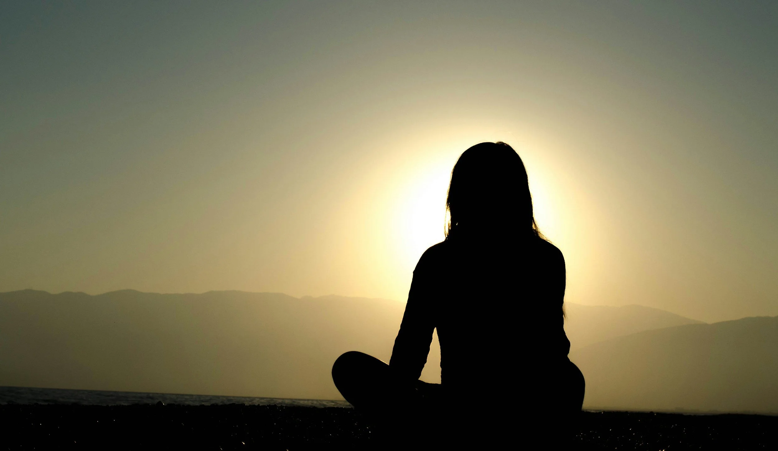 Woman facing the sun before religious trauma and deconstruction therapy