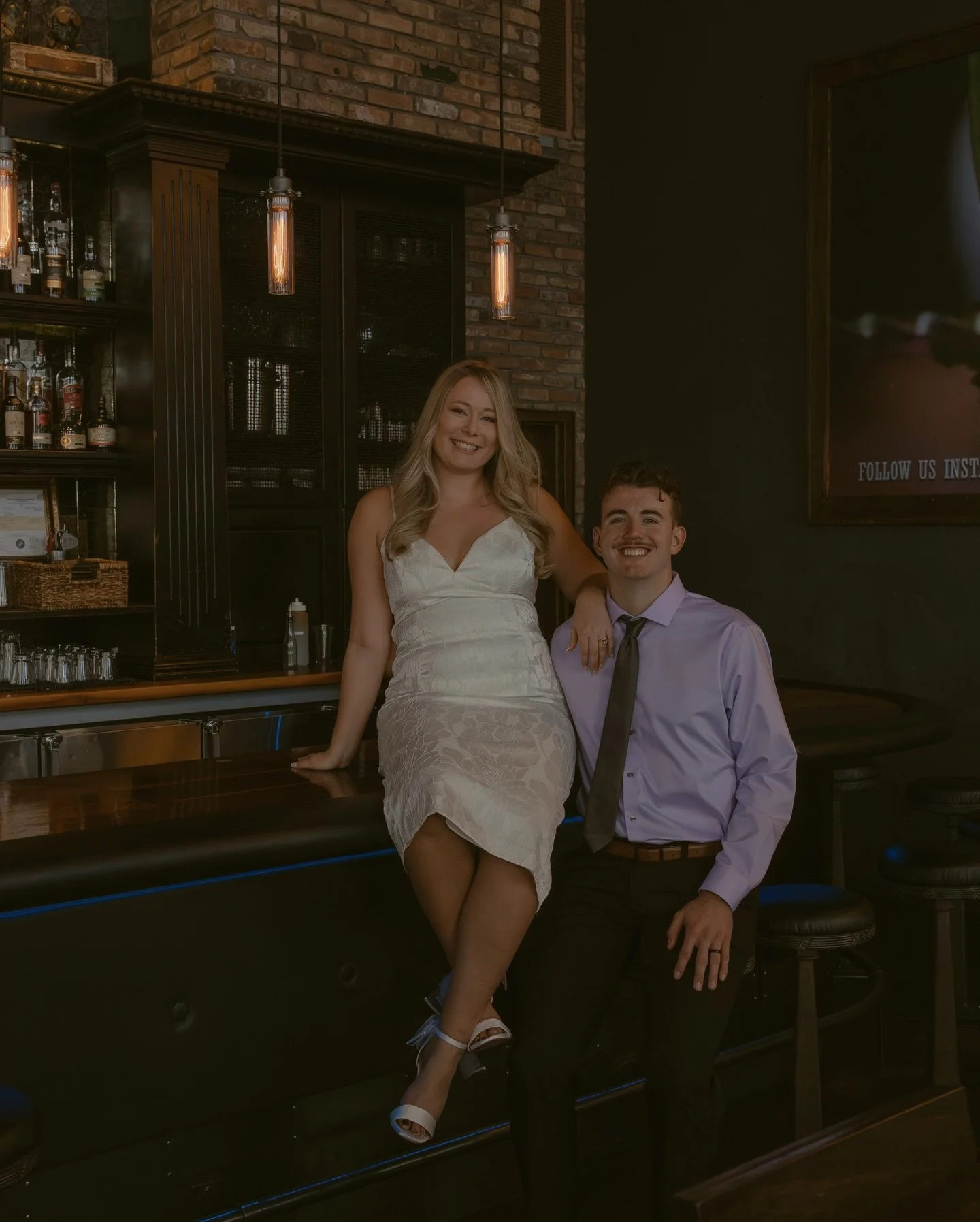 Laura &amp; Jacob chose their favorite bar for their engagement photos; a louder, high-end spot that feels like &ldquo;their place.&rdquo; We bounced between the bar top and the photo booth, keeping it simple and true to how they actually spend time 