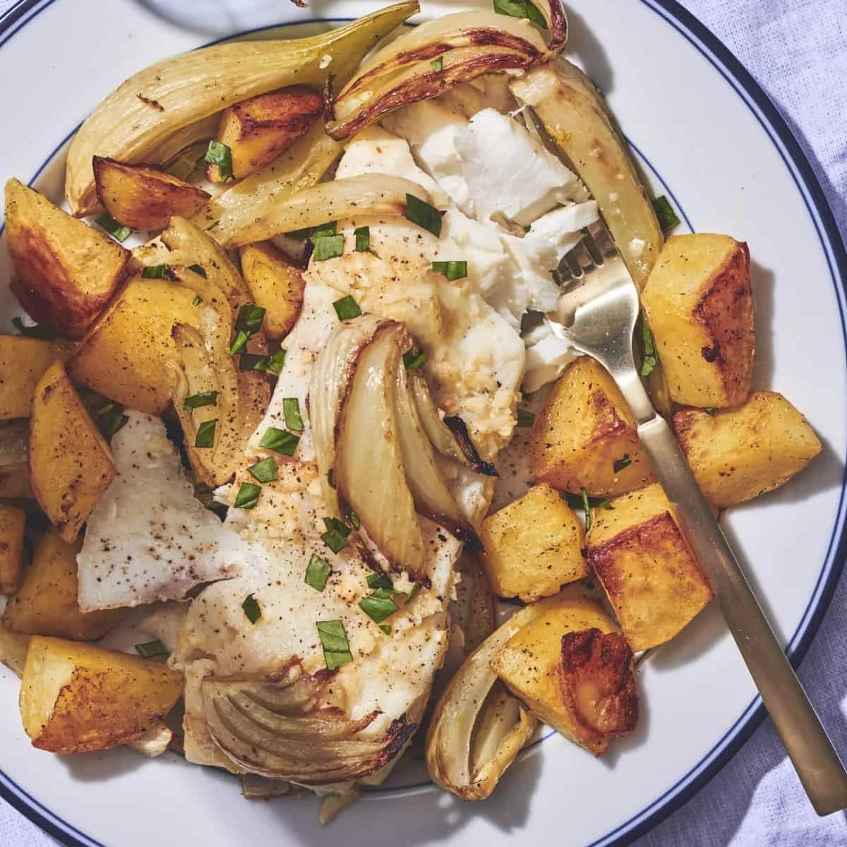 Parchment Poached Halibut with oven-roasted fingerling potatoes and fennel