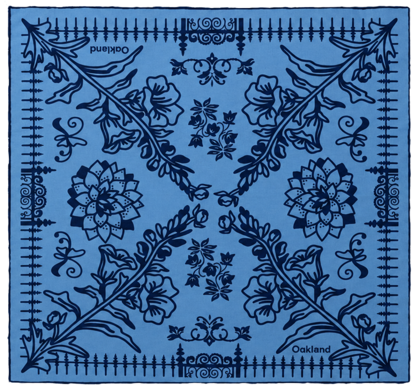 Blue bandana with intricate floral and geometric patterns, including large flowers, leaves, and border decorations, labeled 'Oakland' in the bottom right corner.