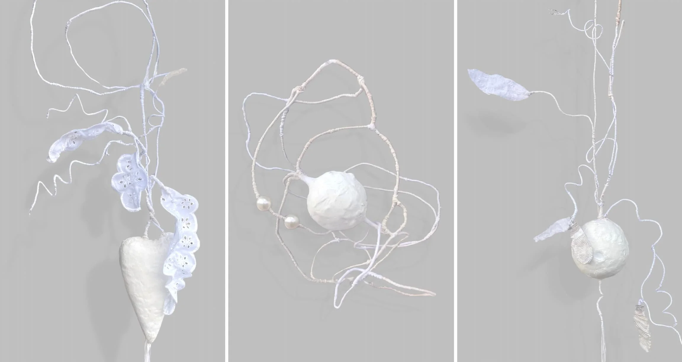 Three-panel triptych showing suspended white sculptural forms against a dark gray background. Each panel features delicate lunar-like shapes connected by looping thread, thin branch-like structures, and tangled organic lines that appear to float.