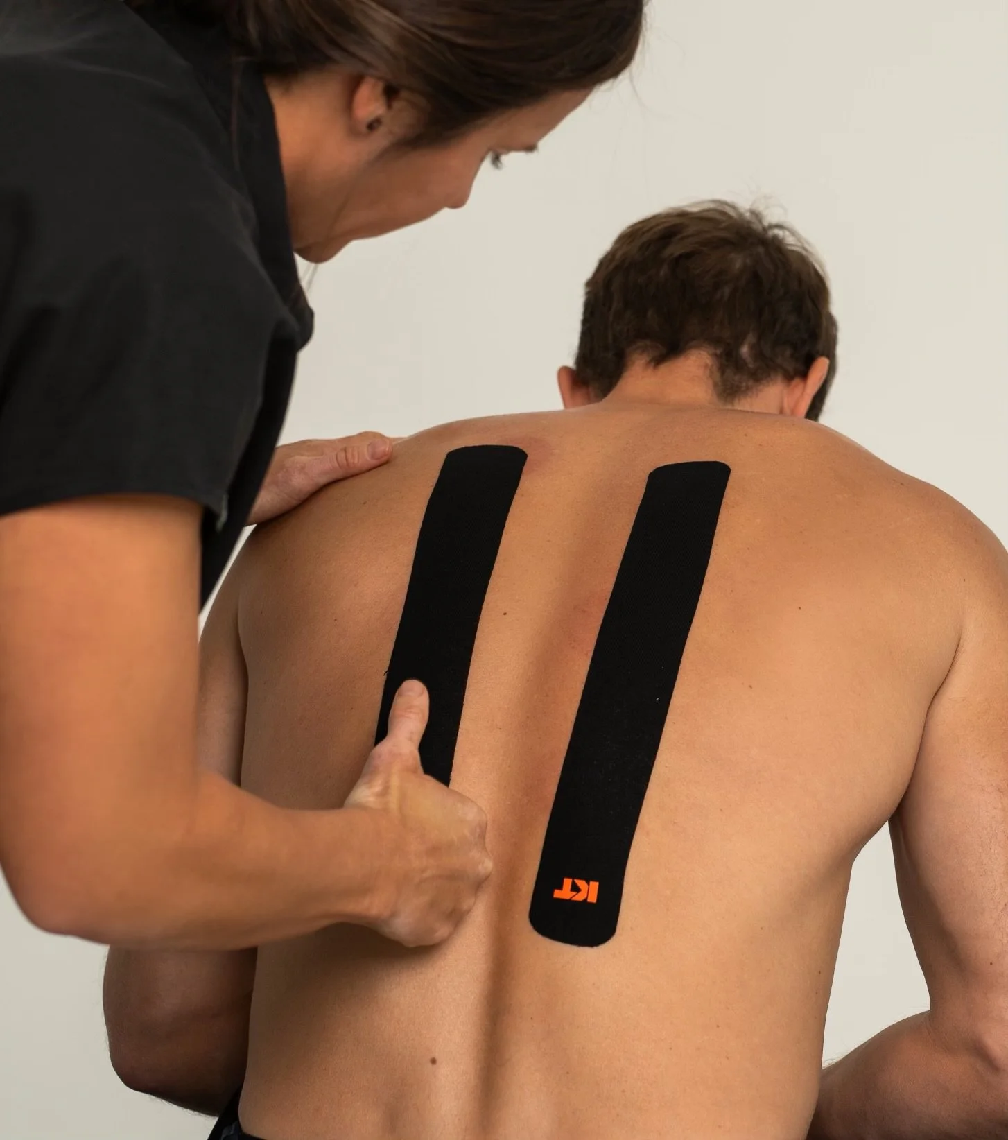Doctor Bryane Heaberlin Kinesiology Tape (KT Tape) on back at St. Petersburg Chiropractic Florida