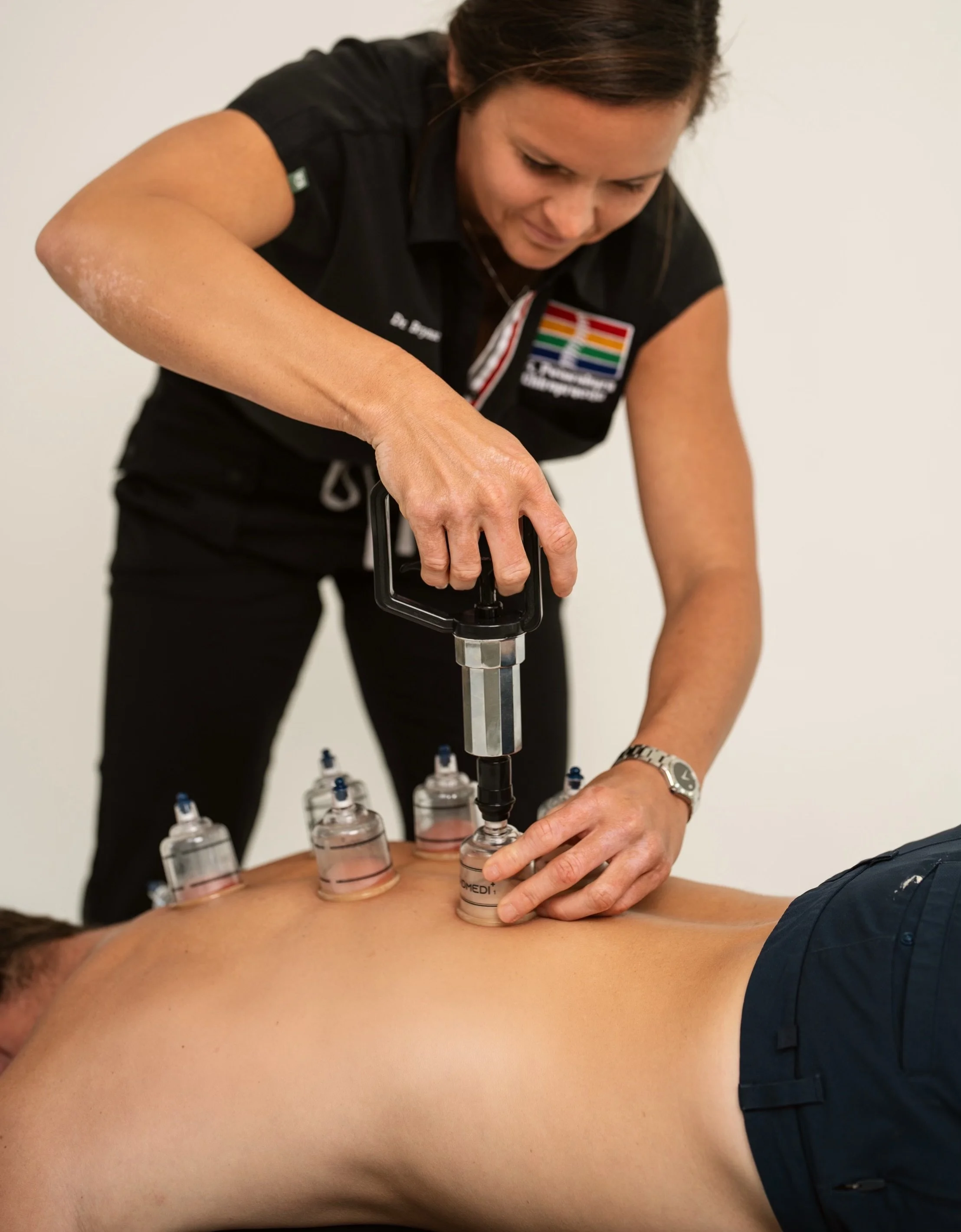 Doctor Bryane Heaberlin cupping on back at St. Petersburg Chiropractic Florida