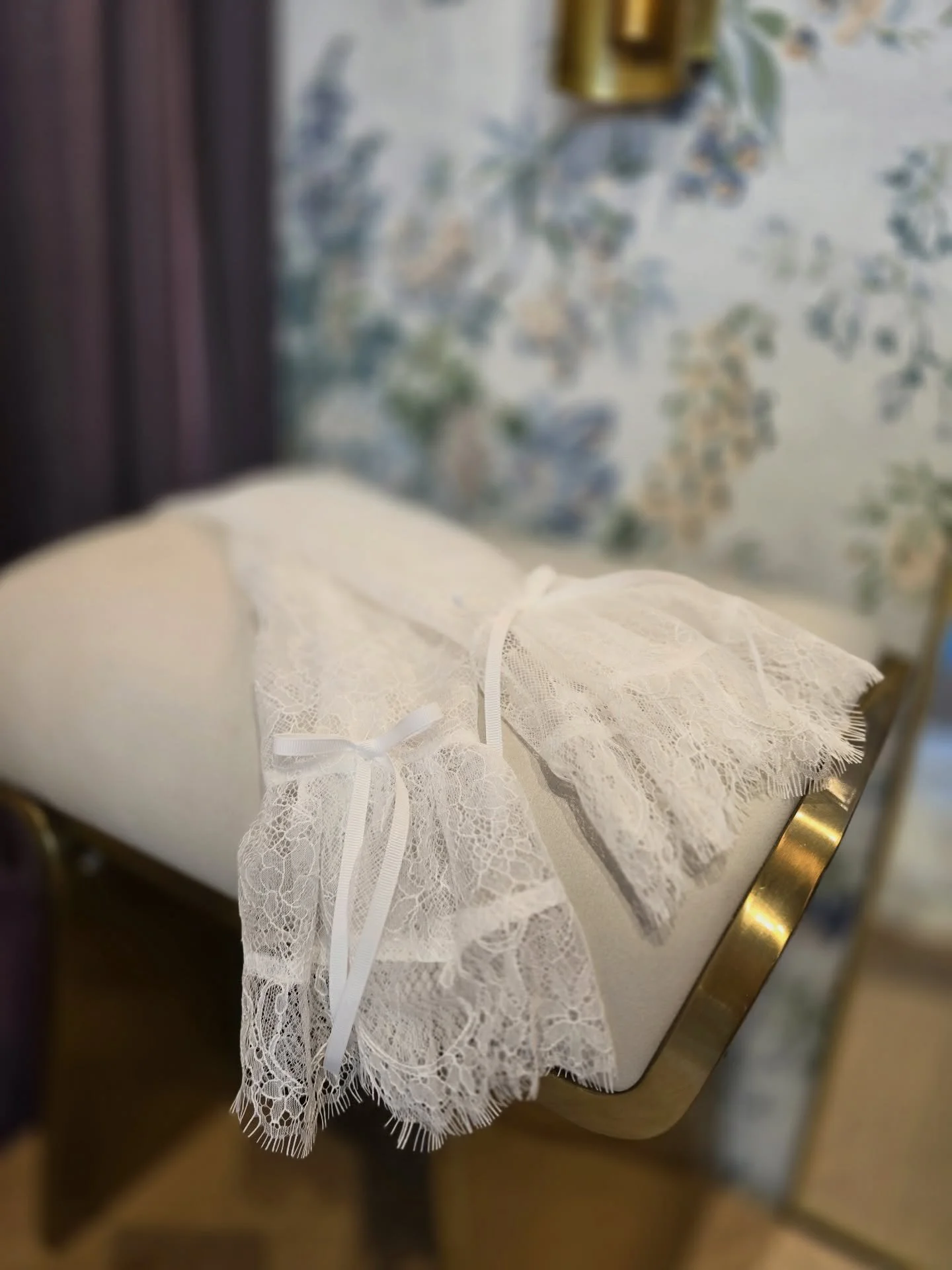 We love bringing thoughtful design to life through fine detail. 

For this piece, we created custom lace sleeves finished with a bow, by sourcing lace directly from the original dress designer. From there, we built the design entirely to her specific