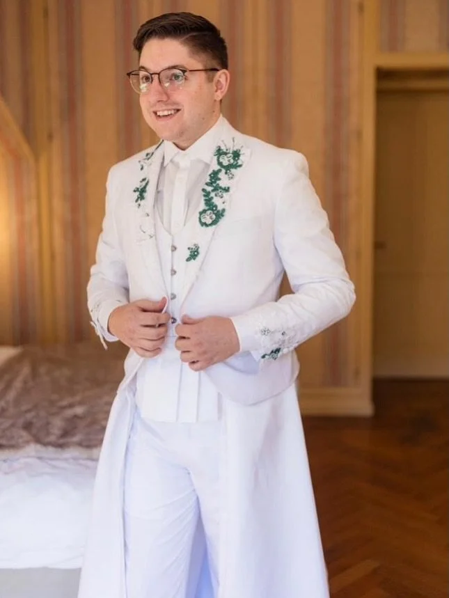 It all started with an AI generated image and turned into something completely one of a kind.

Devin came to us with an idea for his wedding in Italy: a white tux with dramatic structure and movement. Together, we brought it to life! We reshaped the 