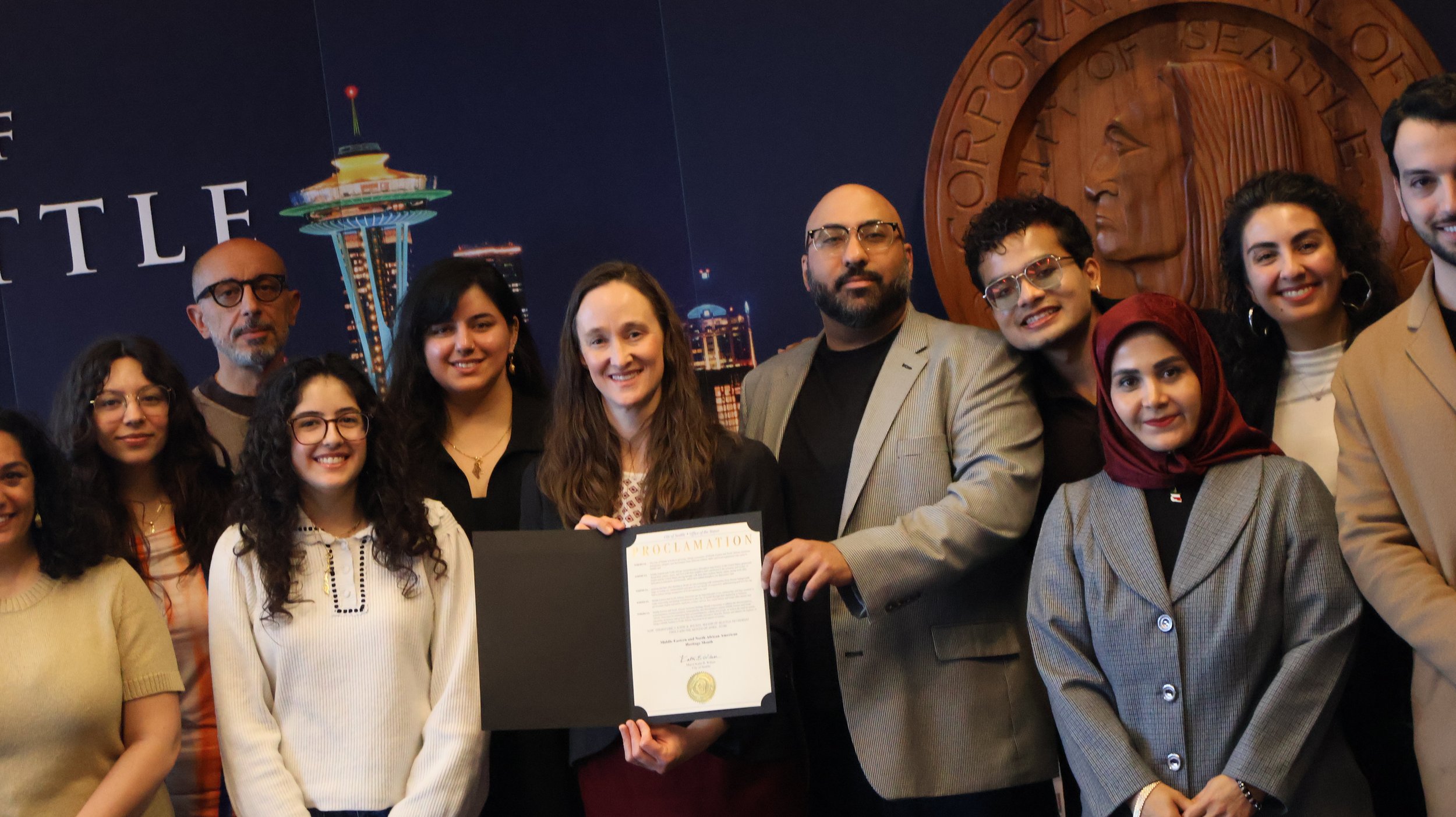 City of Seattle Mayor Katie Wilson issues a proclamation that April is MENA Heritage Month, on April 13th, 2026. She is joined in a photo with MENA (Middle Eastern & North African) community leaders from Iranian, Arab, and Palestinian communities