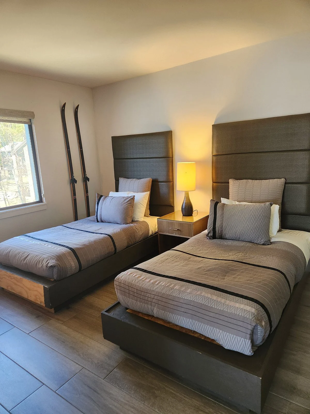 two twin beds with large headboards