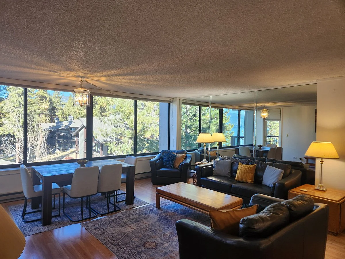 unit 63 living room with black leather furniture