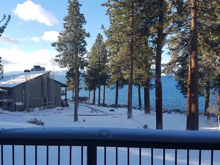 view from back deck showing lake on snowy day