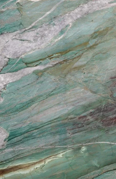 Close-up of green and gray layered marble or stone with natural veining.