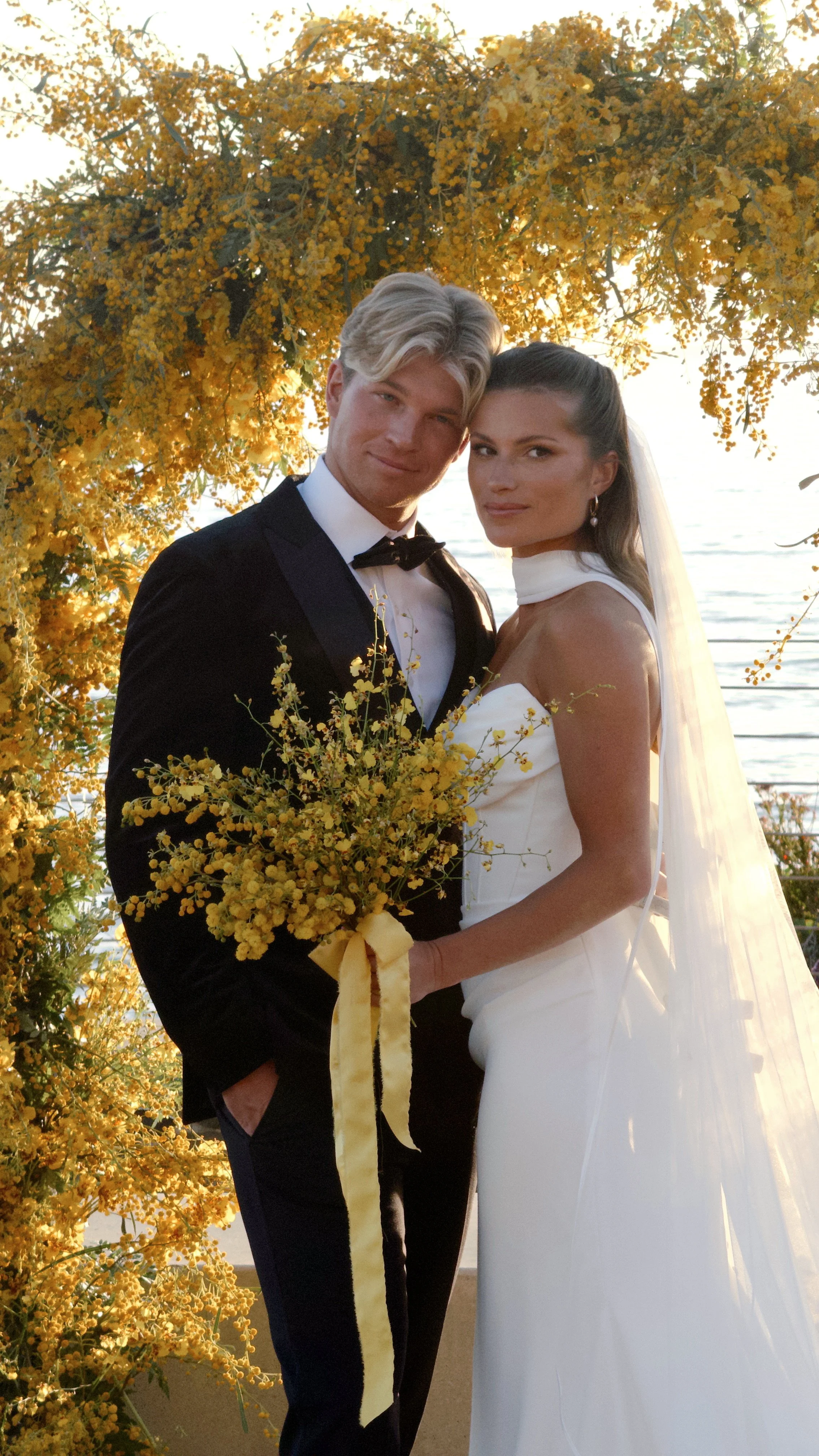 Beautiful yellow wedding inspiration at Alila Marea beach resort captured by san diego wedding content creator who captures behind-the-scenes wedding videos.