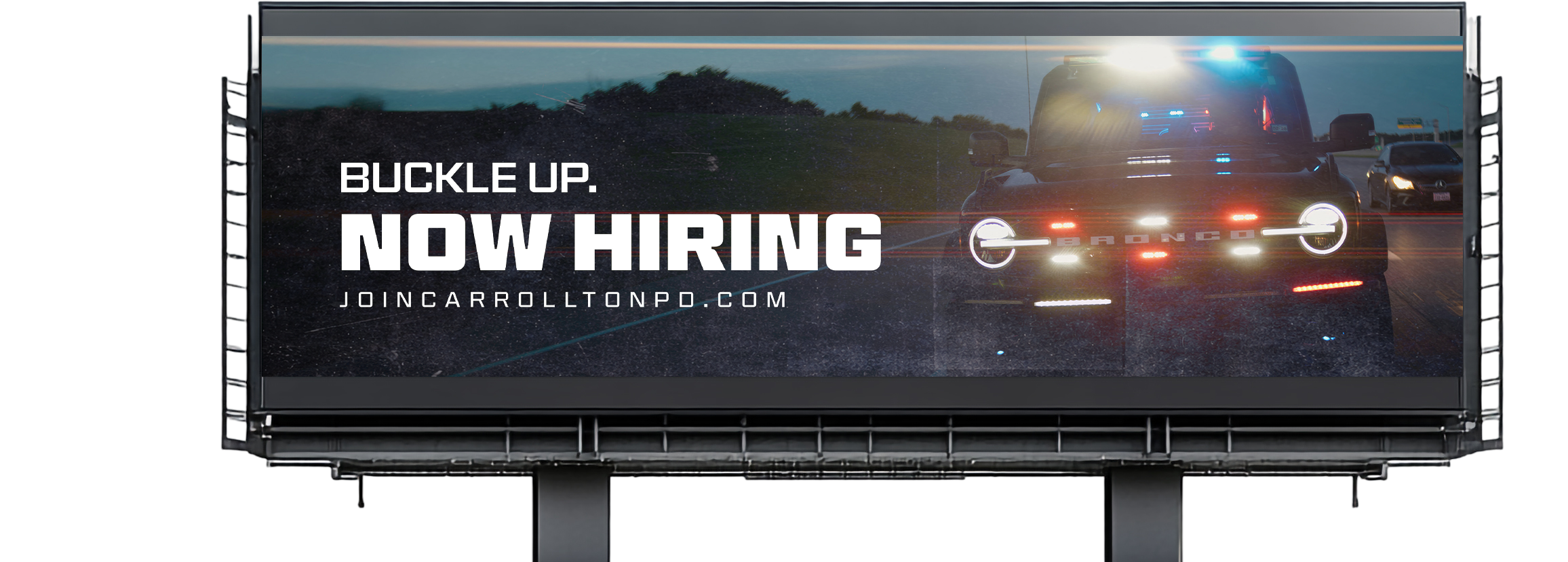 Digital billboard advertising a job opening for carrollers, featuring a black Mustang Mach-E electric vehicle with police lights, on a highway in the evening with trees and other cars in the background.