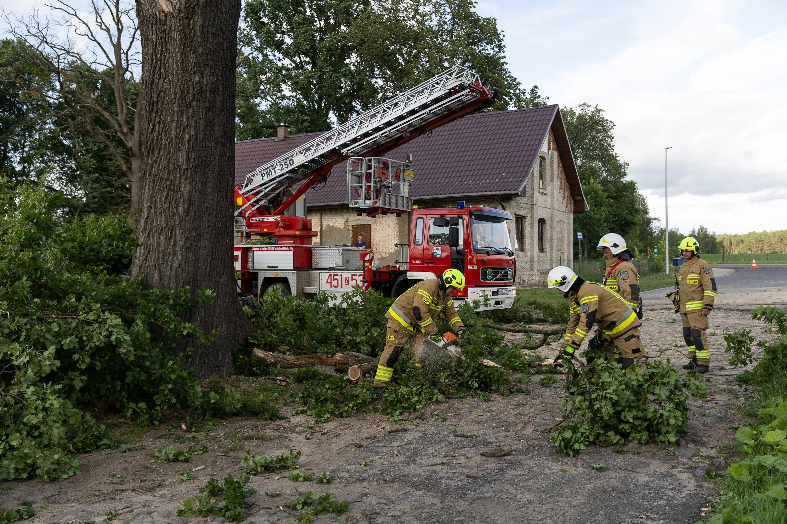 Firefighters responding to the effects of a storm in the village of Mętno Małe, Poland, June 27, 2025