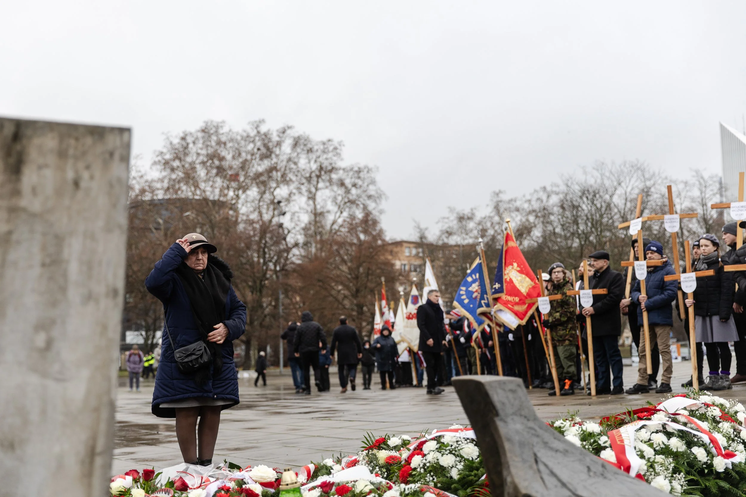 Laying flowers at the "Angel of Freedom" monument during the anniversary of the "December 70" strikes, Solidarity Square, Szczecin, Poland, December 17, 2024
