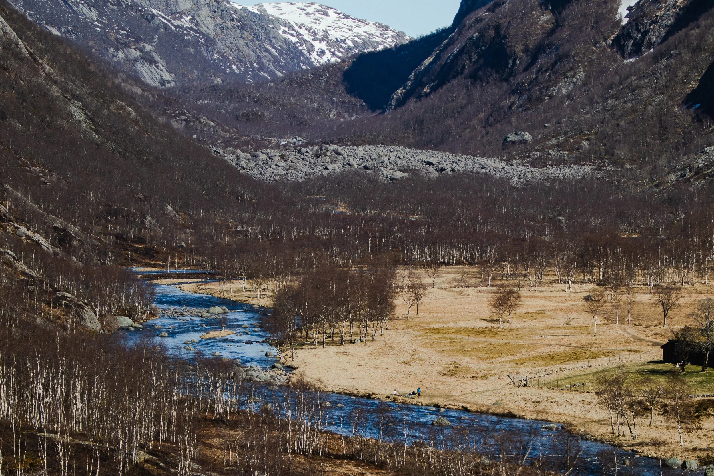 A stream, visible while climbing the trail to Månafossen waterfall, Norway, April 21, 2023