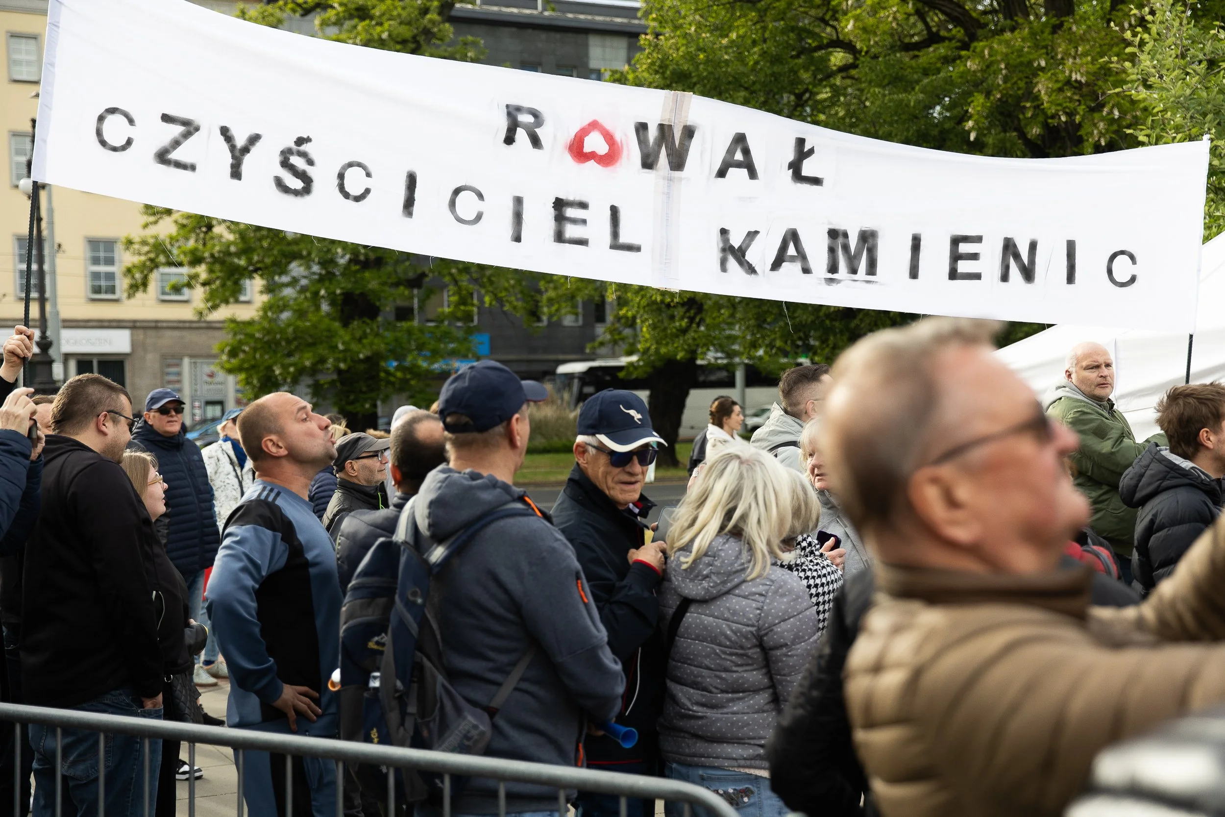 Banners "rował, house cleaner" during the rally of presidential candidate Rafał Trzaskowski, Solidarity Square, Szczecin, Poland, May 15, 2025
