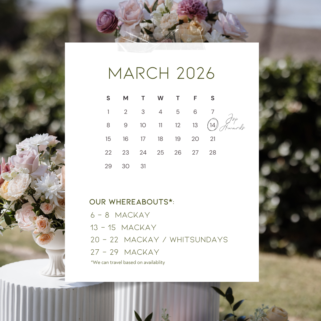 A wedding or event calendar for March 2026 with floral decorations at the top and bottom, featuring a bouquet of pink, white, and purple flowers on a white pedestal outside.