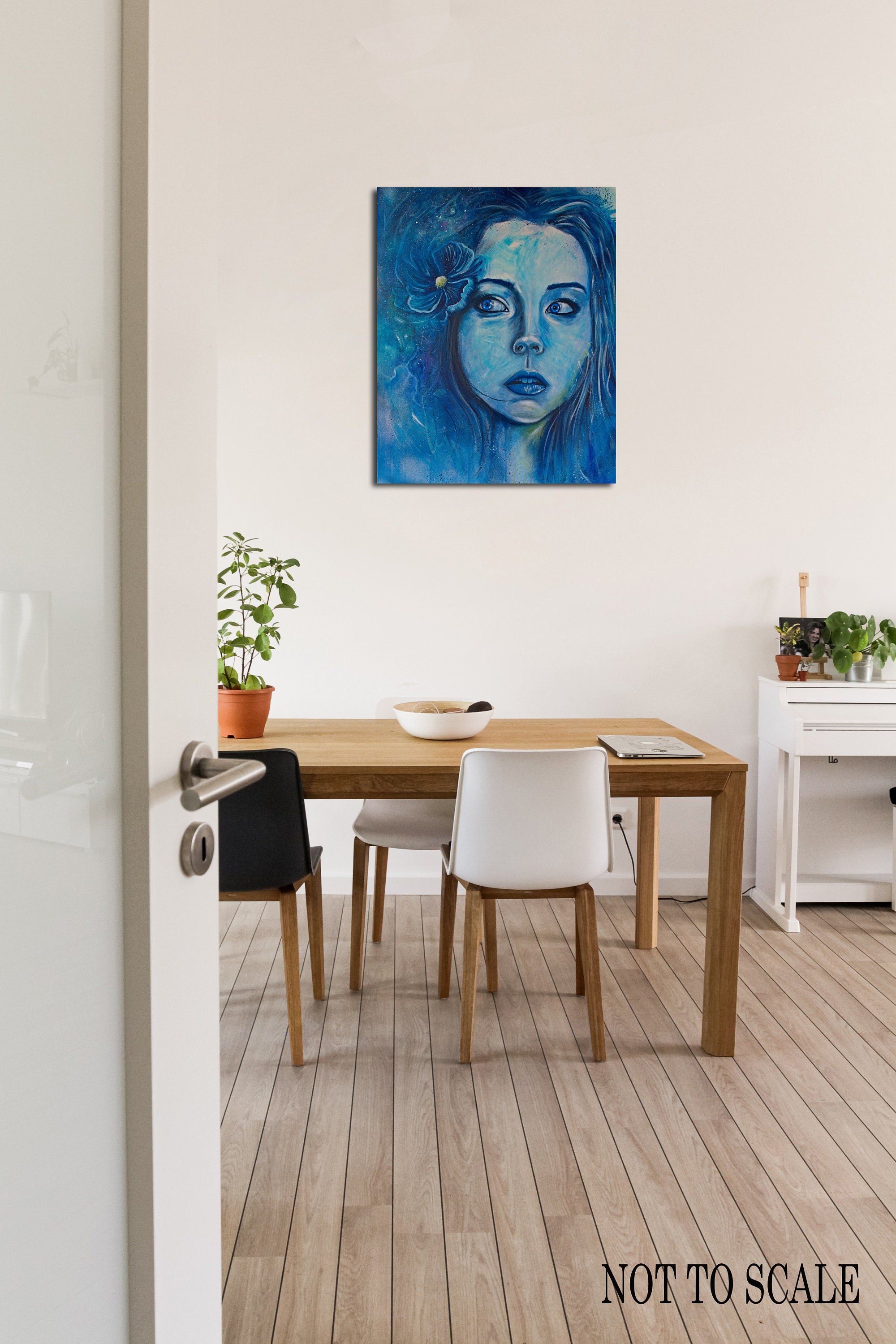Woman's Face Portrait All in Blue. Eyes looking to the left in distrust on a wall in a room.