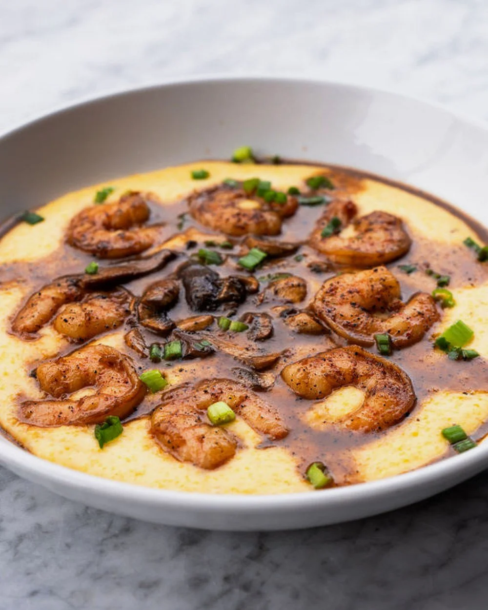 A true Southern classic done STIR-style. 🍤✨

Our made-from-scratch Shrimp &amp; Grits combines tender shrimp, mushrooms, green onions, and savory shrimp stock, all atop creamy white cheddar grits.

Browse our full menu and book your table today at s