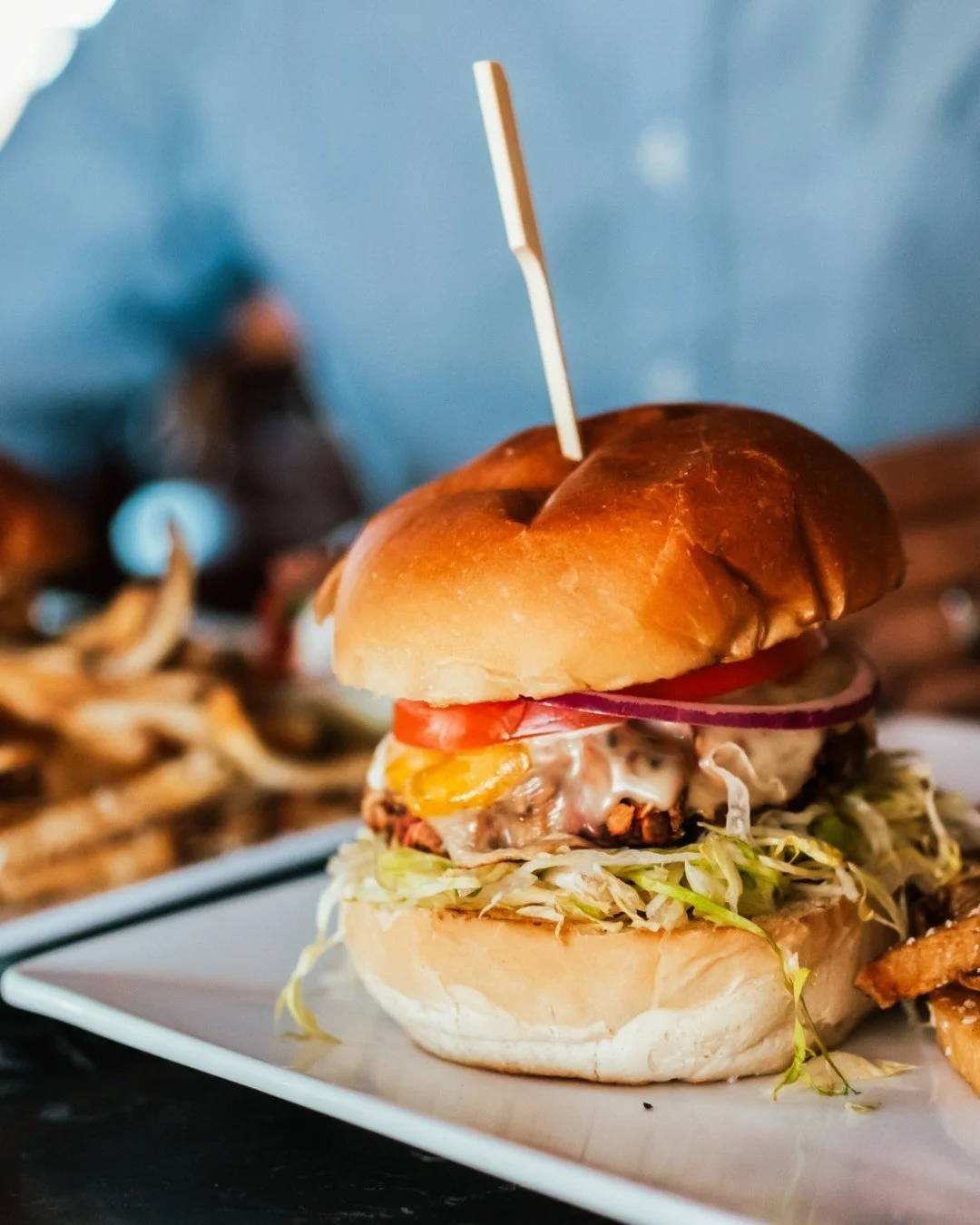 Steakhouse flavor, burger bliss. 🍔

A fresh-ground blend of filet and sirloin, sharp white cheddar, and spiced pickle aioli, topped with shredded lettuce, house pickles, and a crisp iceberg wedge. Served with hand-cut fries because&hellip; of course
