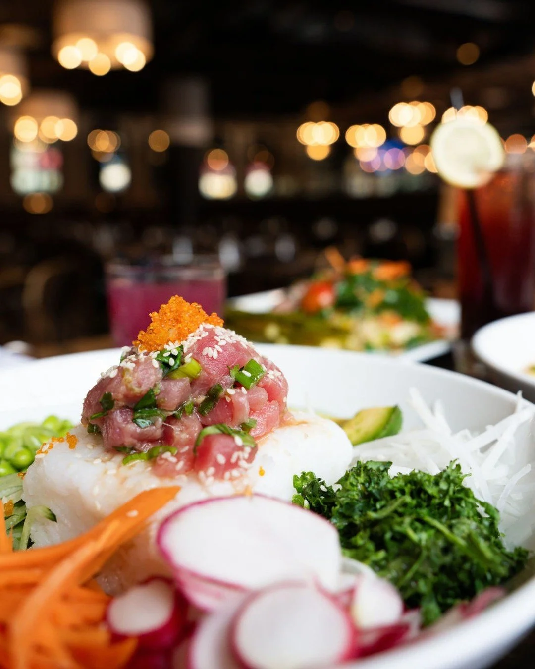 Not to be dramatic, but the Tuna Poke Bowl deserves its own fan club 🍣

Citrus soy-marinated tuna over seasoned rice with fresh veggies, creamy avocado, sriracha wonton crisps, and a miso vinaigrette all layered into one seriously satisfying bowl.

