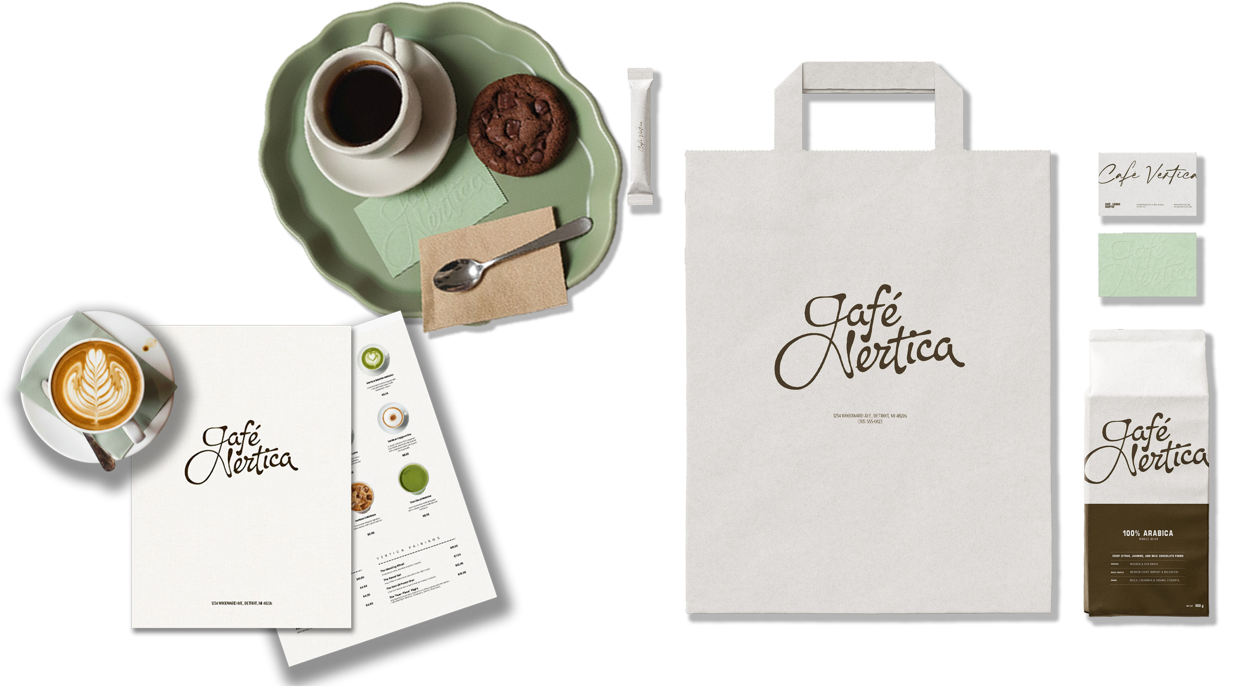 A flat lay of café items including a latte with latte art, a coffee, a chocolate chip cookie, a spoon, a napkin, a green saucer, a sugar packet, a menu, and printed takeaway packaging from Café Nétrica with a box, a bag, and a carton of coffee.