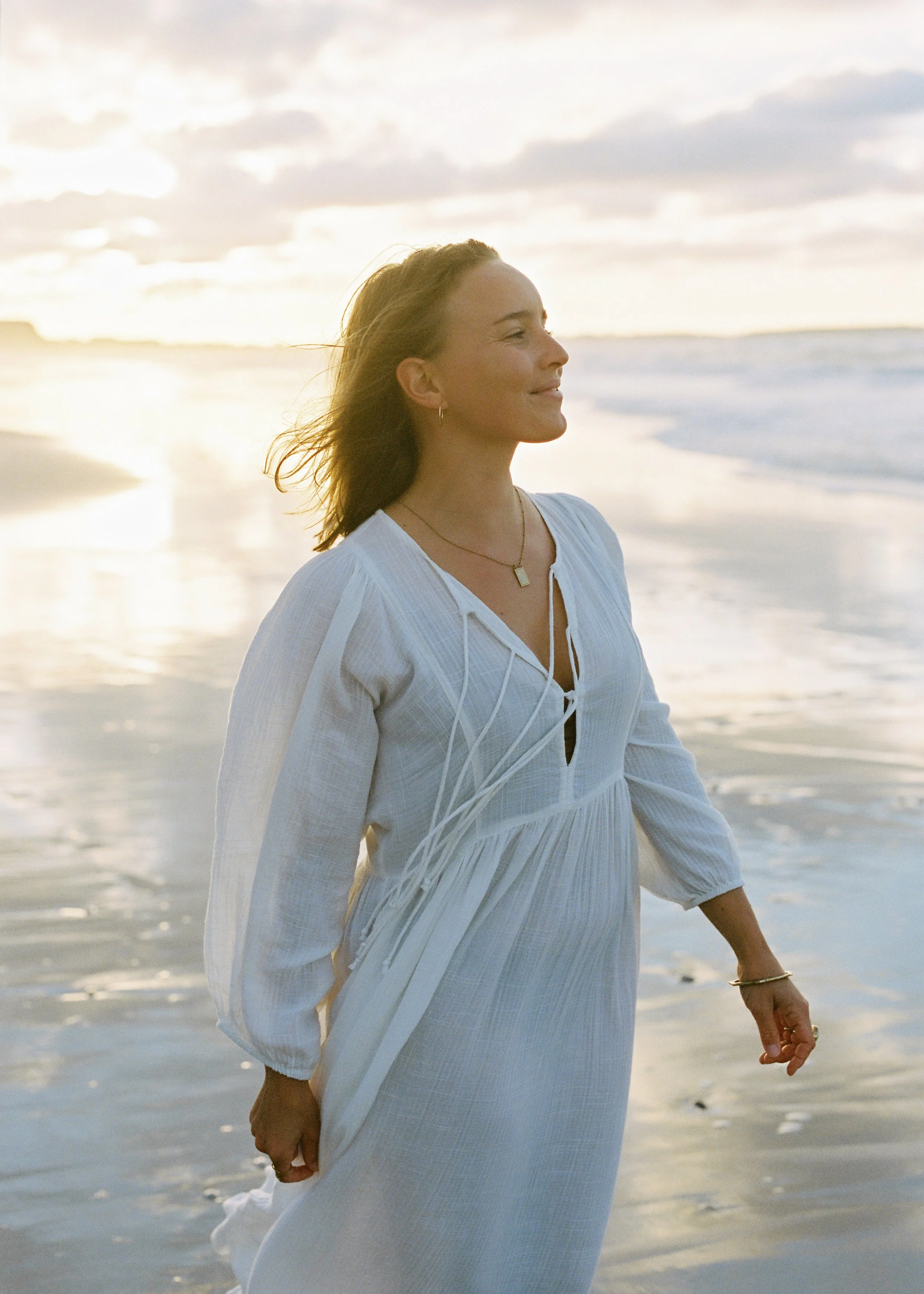 Annabel on a beach in portugal smiling
