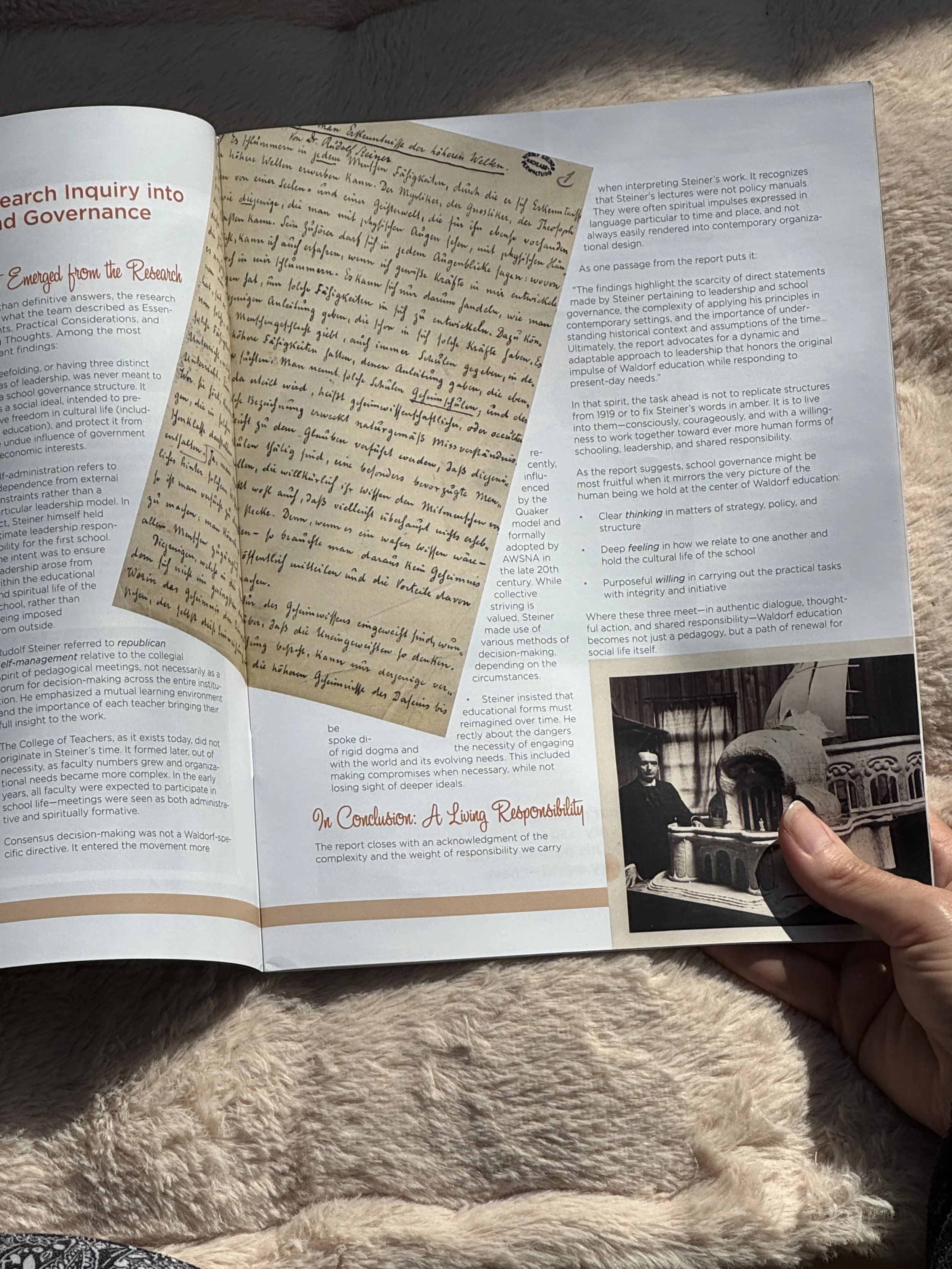 Open School Renewal magazine spread held by hand against a soft, warm beige textured background, reflecting the human touch and care behind Allvibe Creative’s publication work.