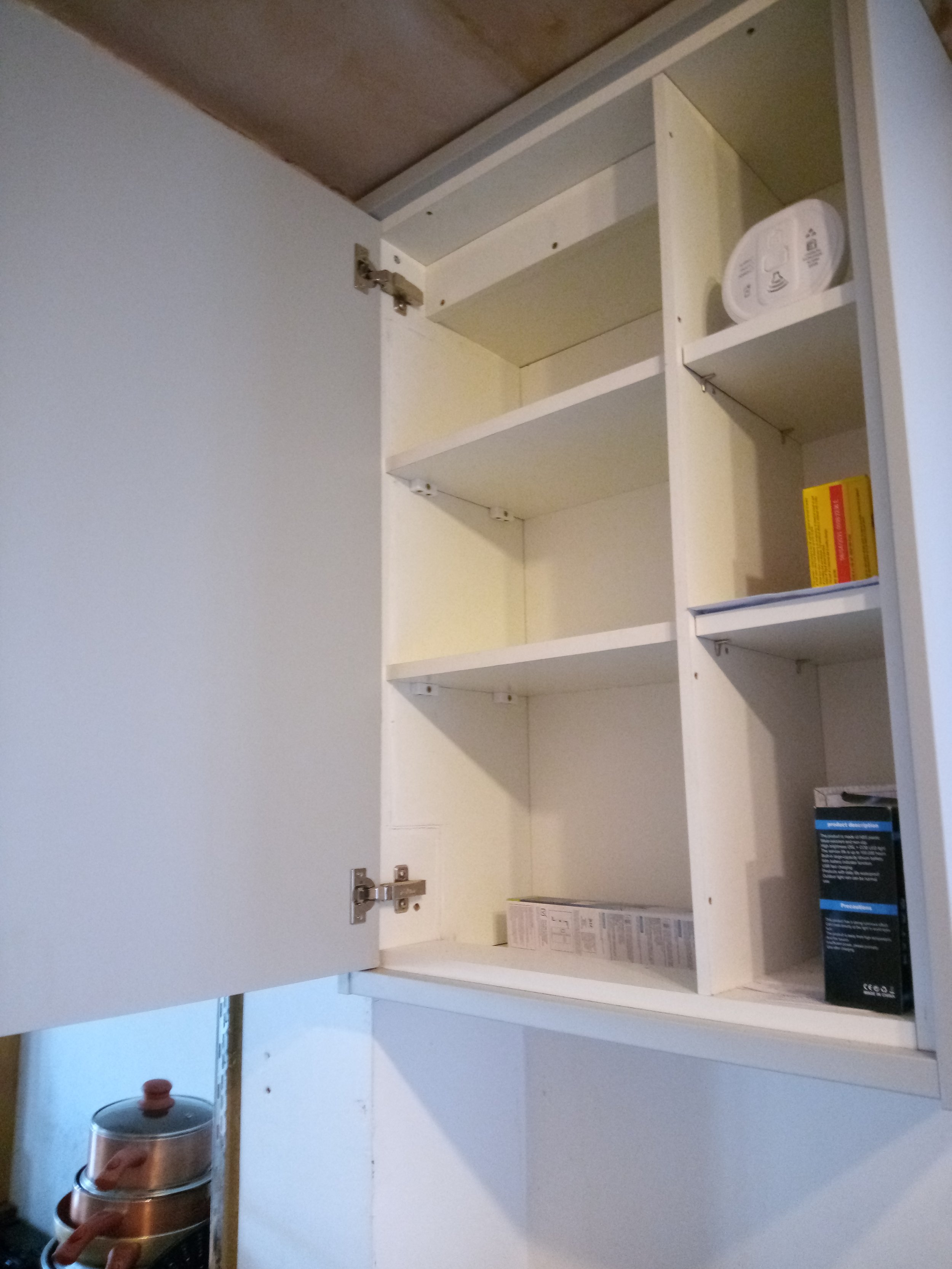 Kitchen cabinet boarded and shelved