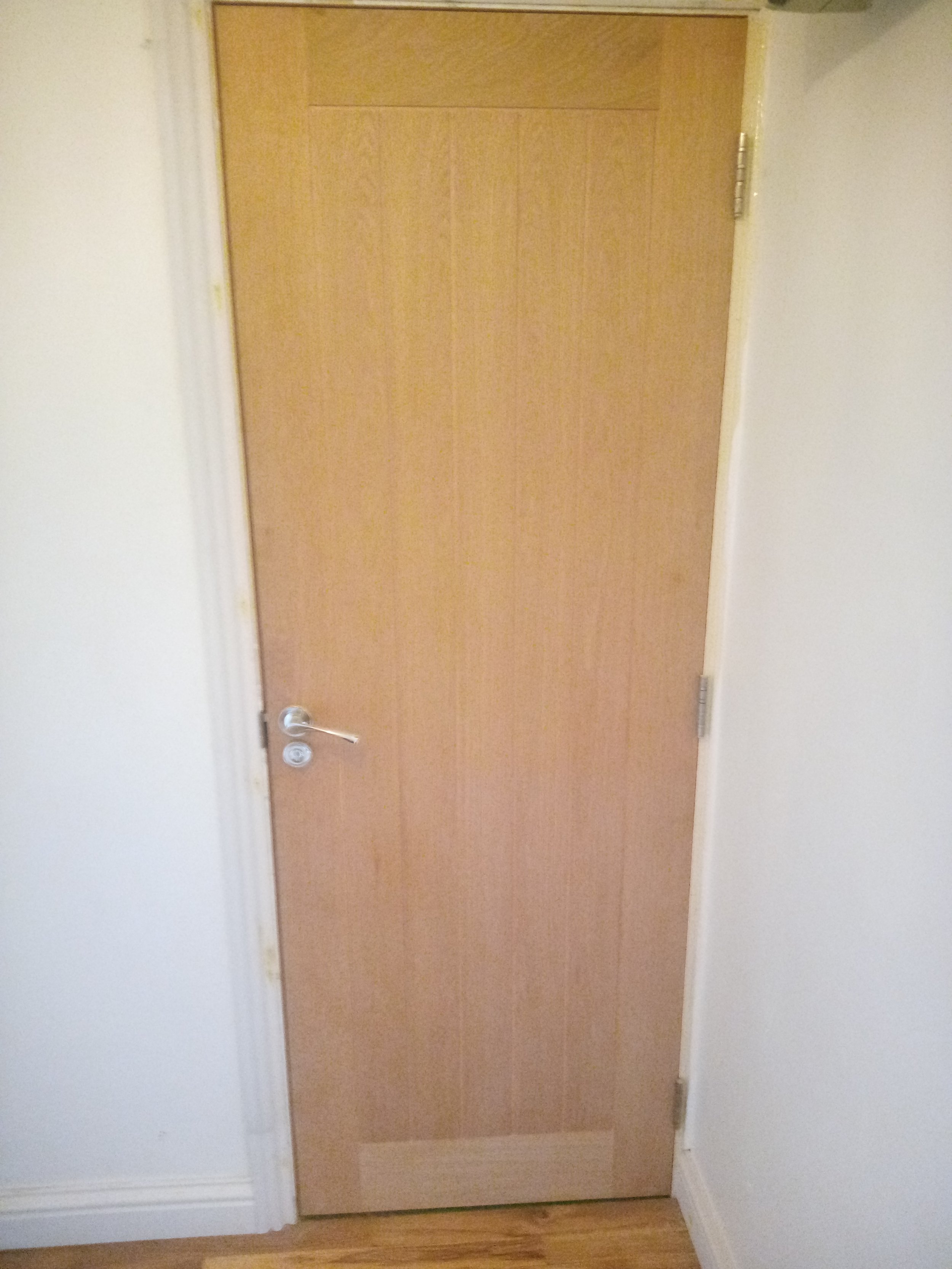 Oak door hung, architrave and skirting fitted