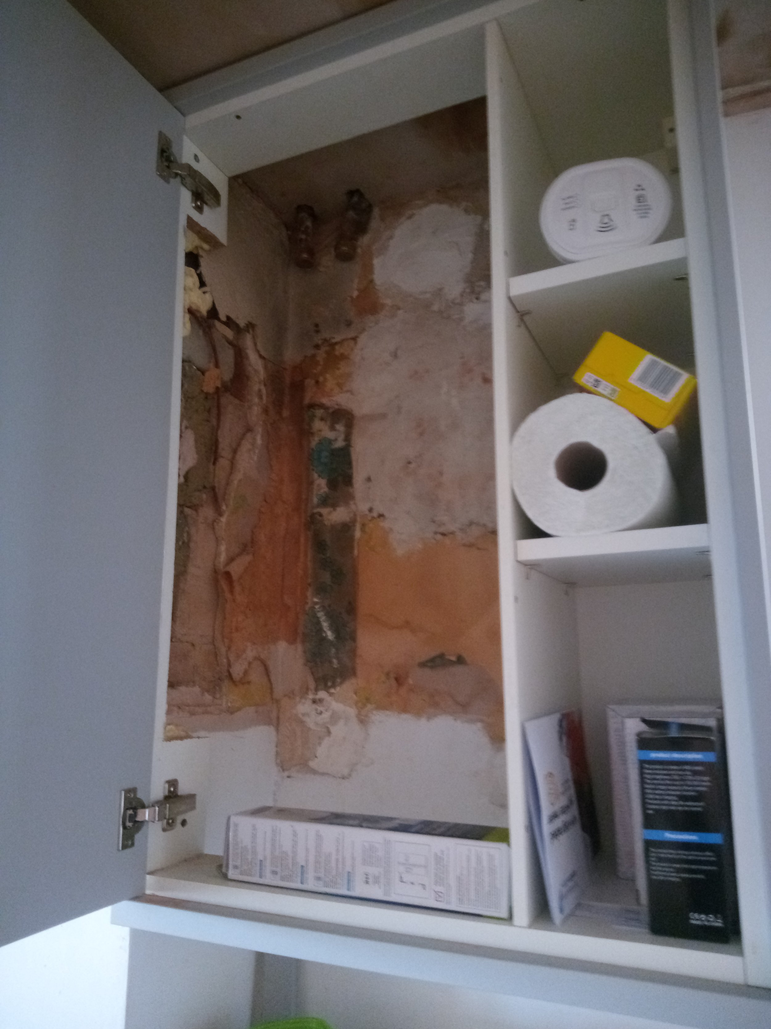 Kitchen cabinet after boiler removed