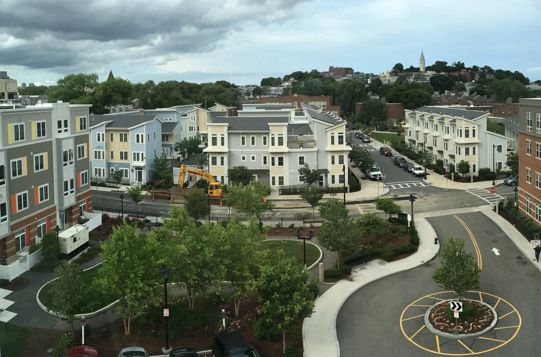 Aerial image of a neighborhood with townhomes and tree-lined streets