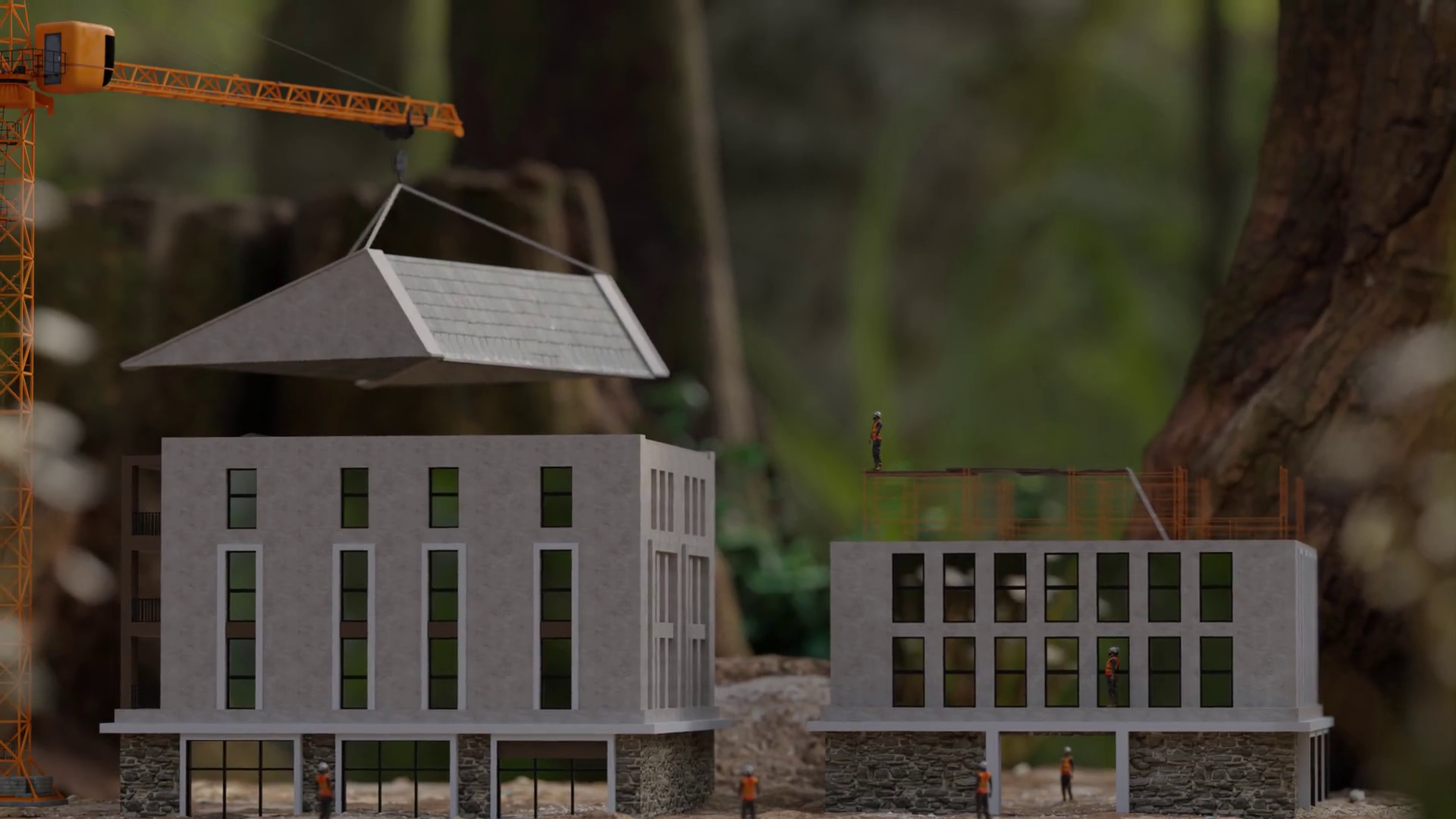 A crane is placing the roof of a miniature building, illustrating an urban construction setting.
