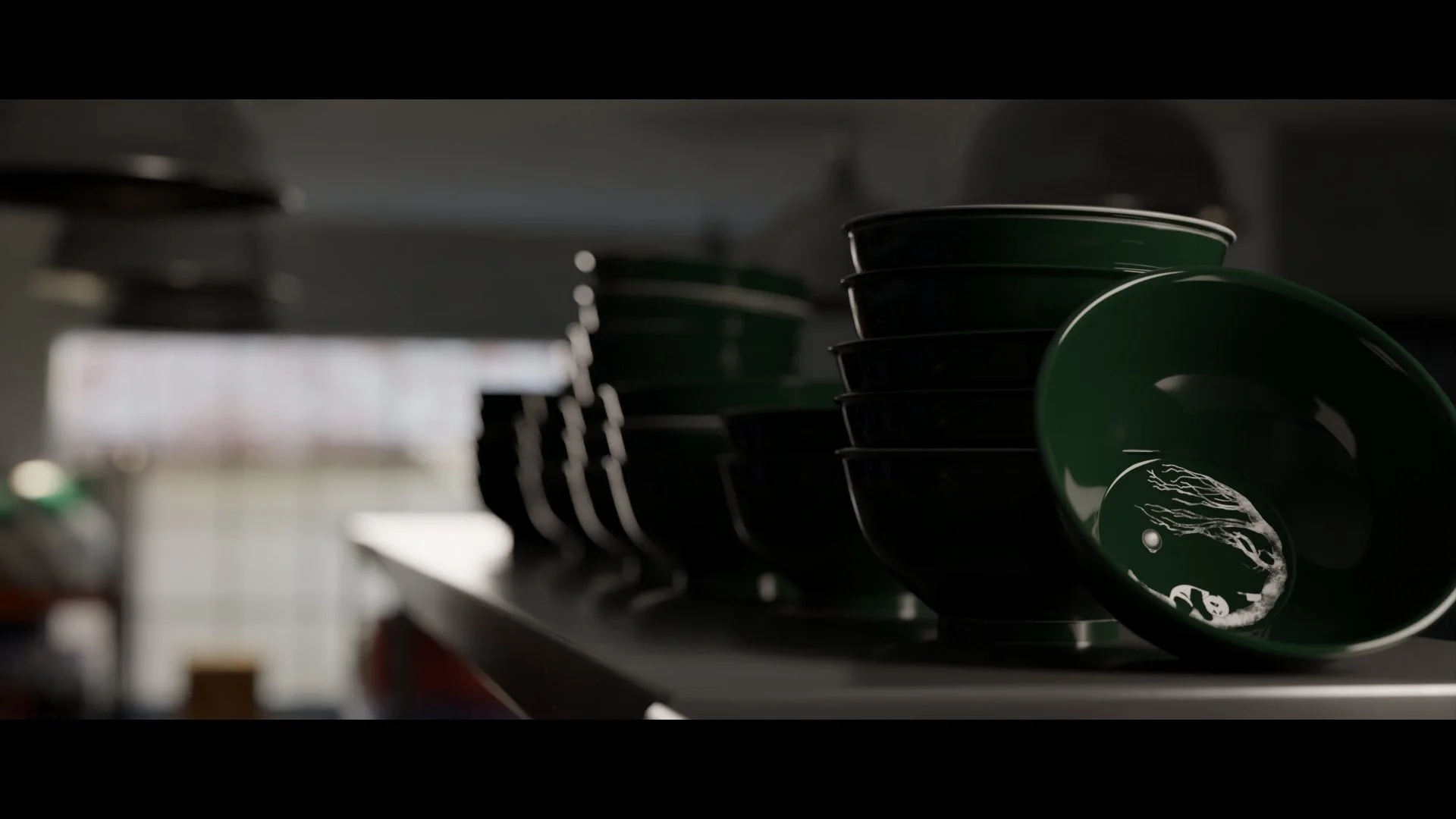 A close-up render of stacked green bowls with a delicate white illustration inside one bowl, highlighting sleek design and reflective textures in a dimly lit kitchen environment