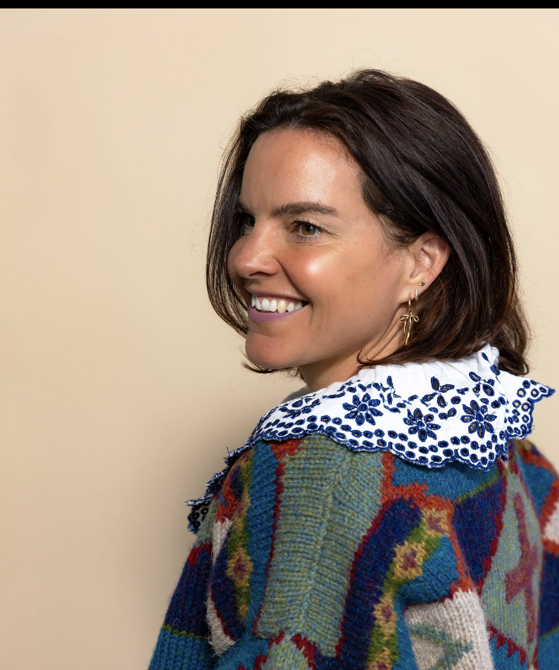 side profile portrait photography of female with brown hair smiling