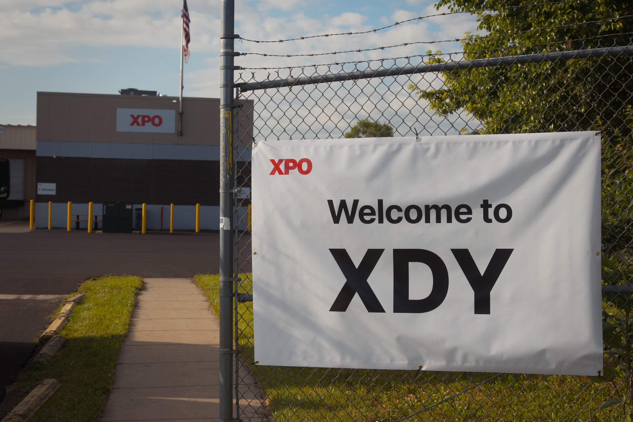 Artistic photo taken at the grand opening ceremony of a large freight company's new location, captured with professional cameras.
