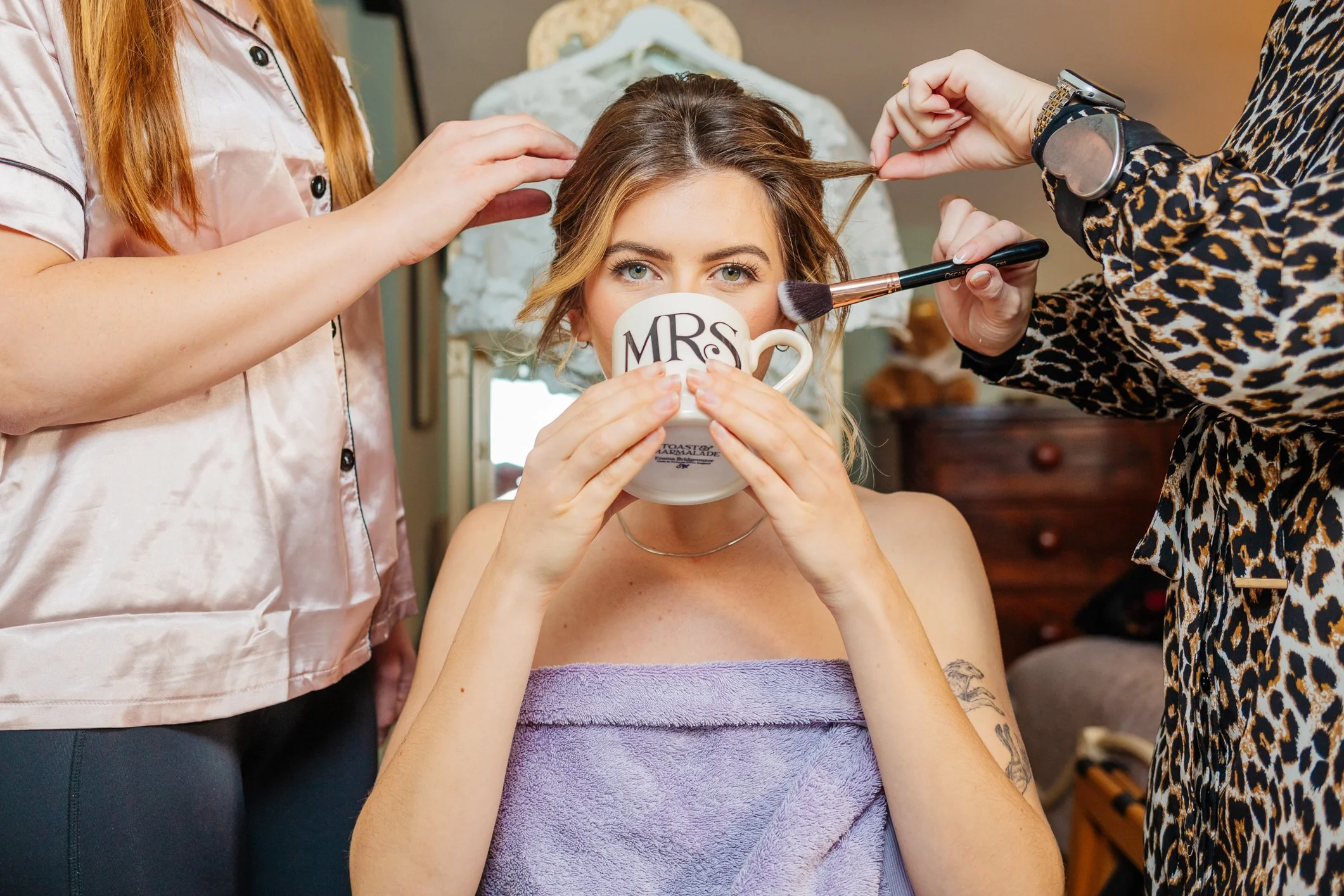 A bride-to-be having her make up done ahead of her micro wedding on Exmoore