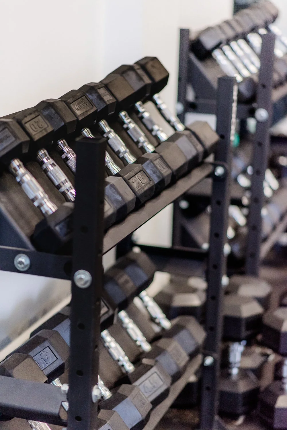 Rack of hex dumbbells in a gym