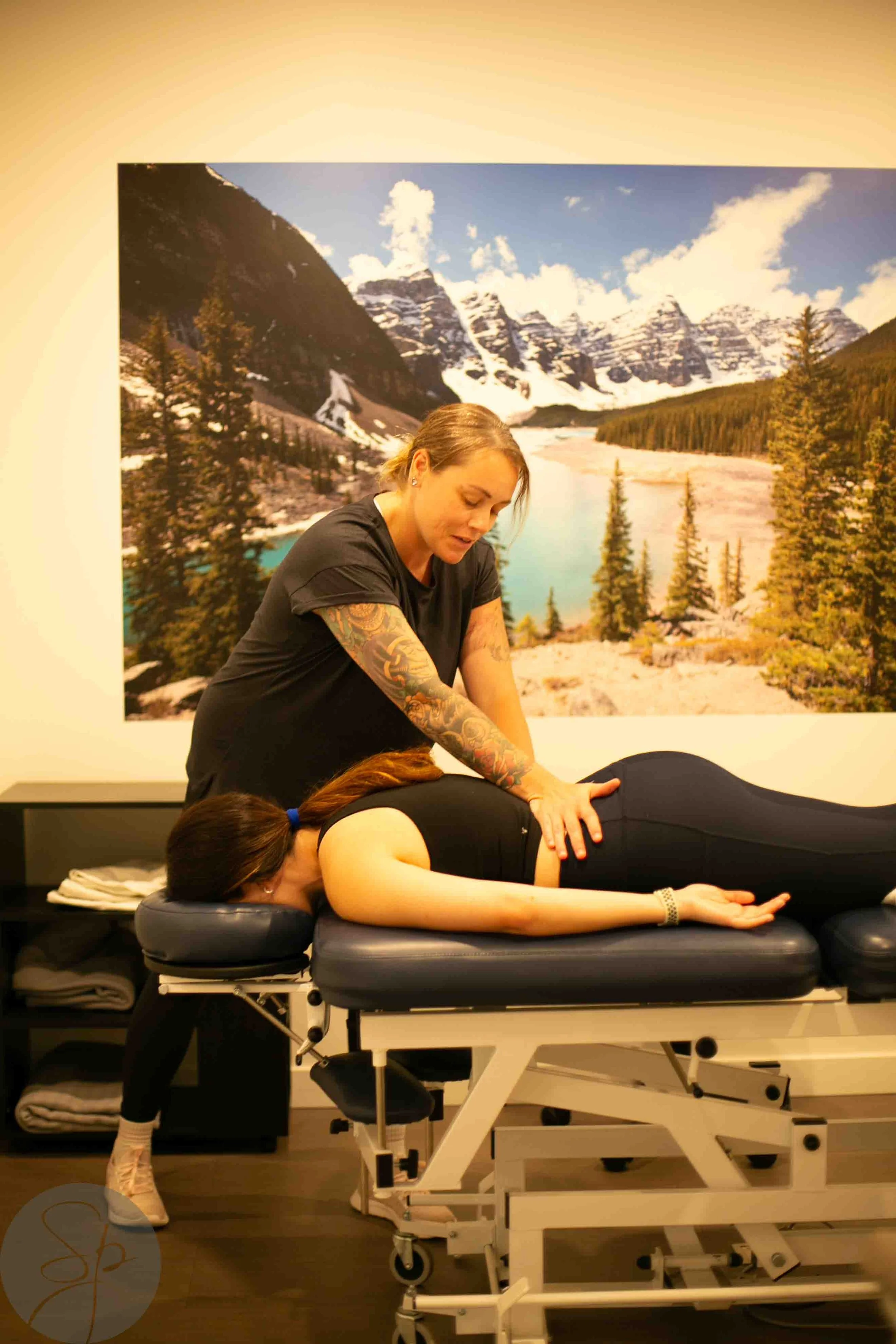 Person receiving massage therapy on a treatment table
