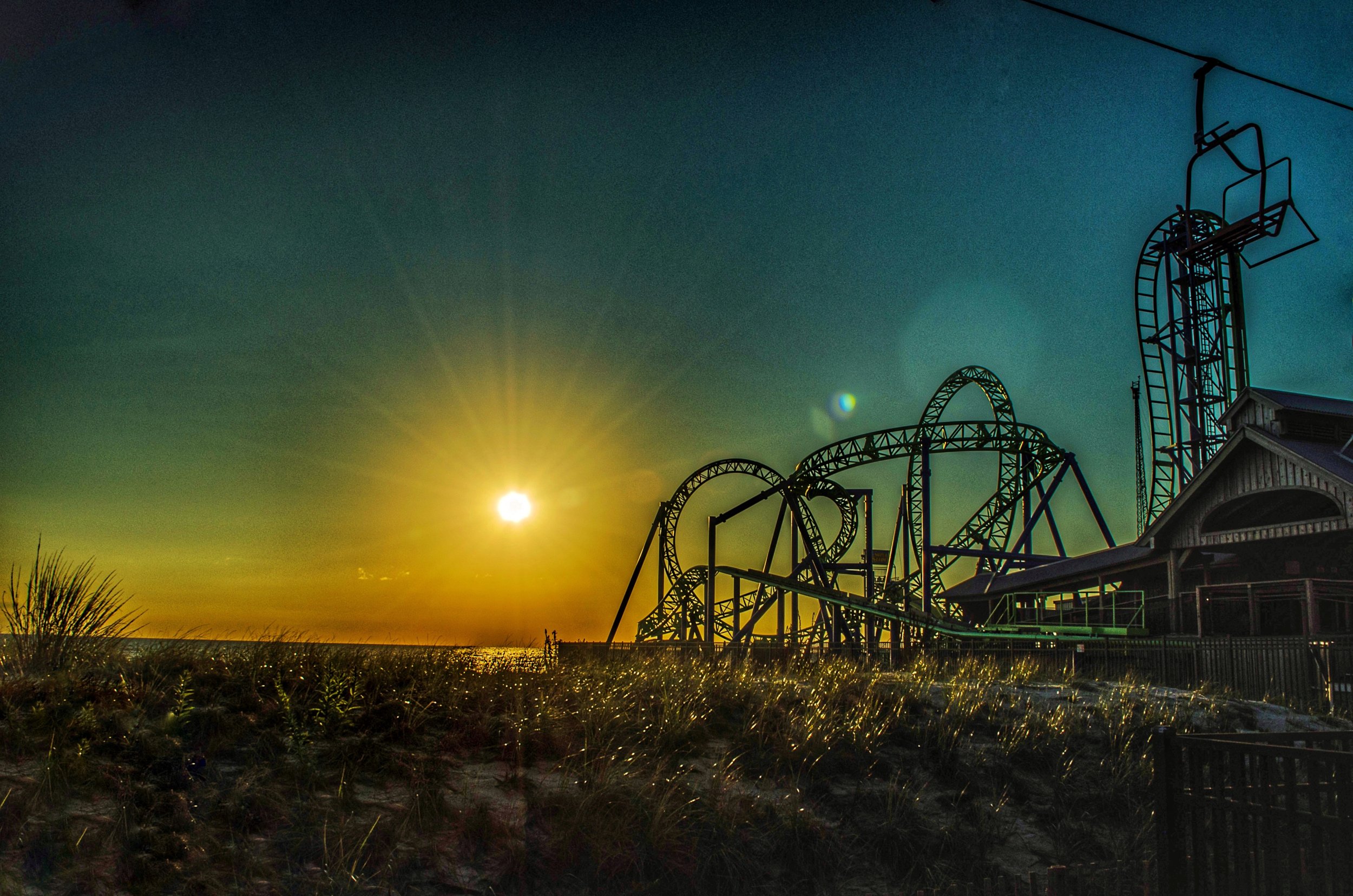 "Sunrise Seaside" ~ The sun greets the now rebuilt Casino Pier, in Seaside Heights, New Jersey. (Seaside Heights, New Jersey)