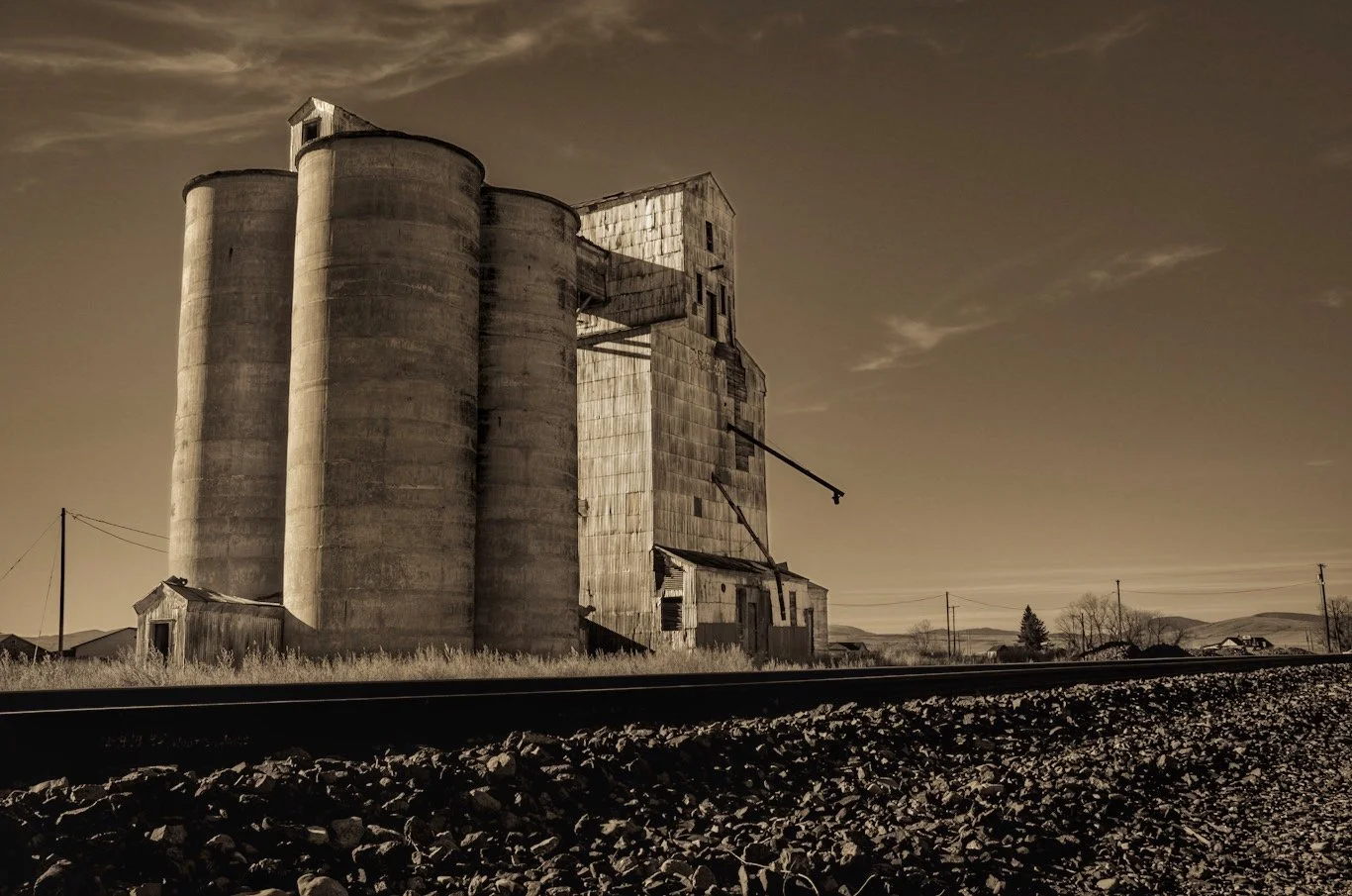 A grain elevator in Windham, Montana, where no less than 30 seconds after I decided to leave, a freight train came rolling through. (Windham, Montana)