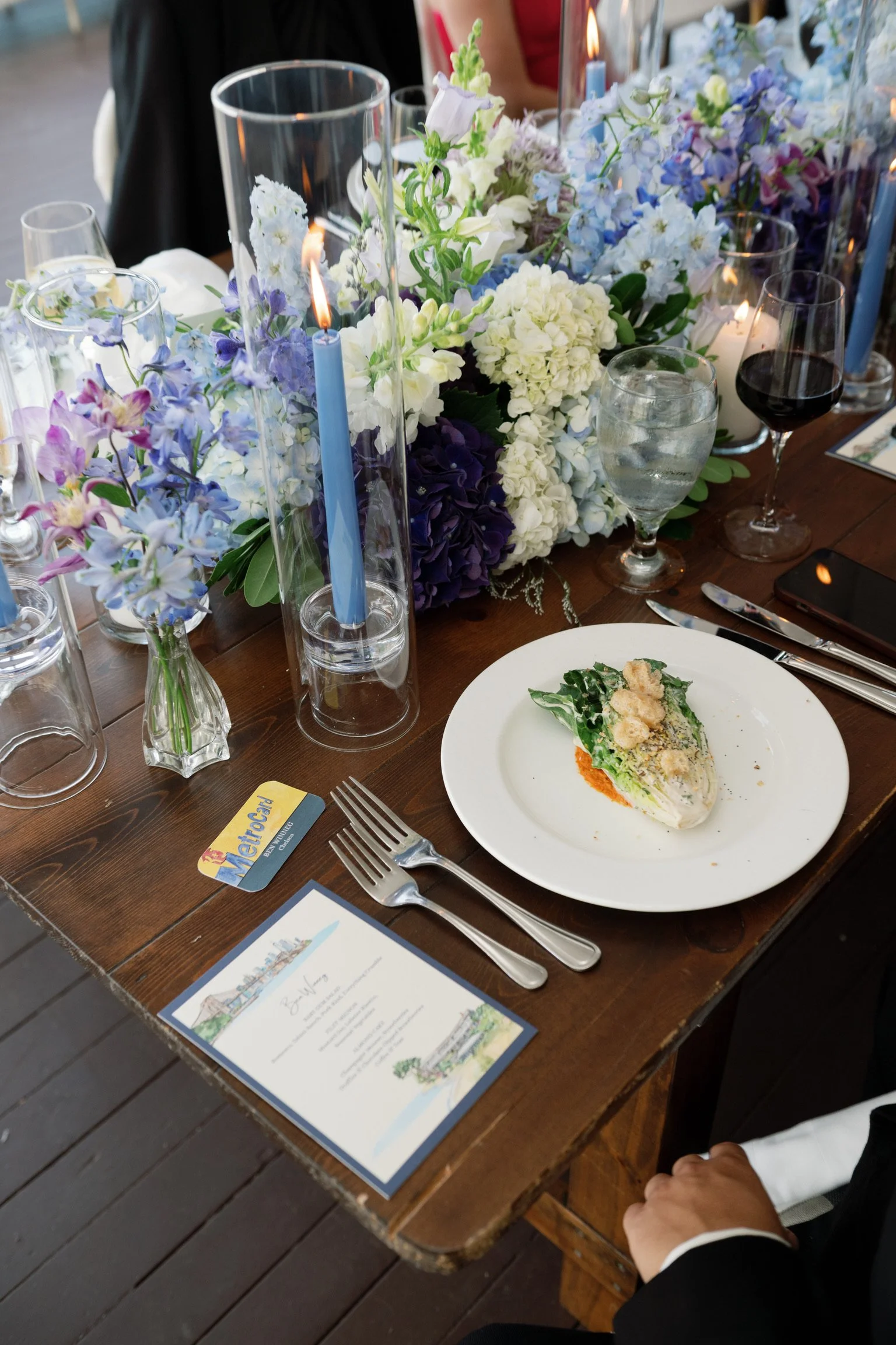A wedding tablescape with custom-illustrated watercolor stationery