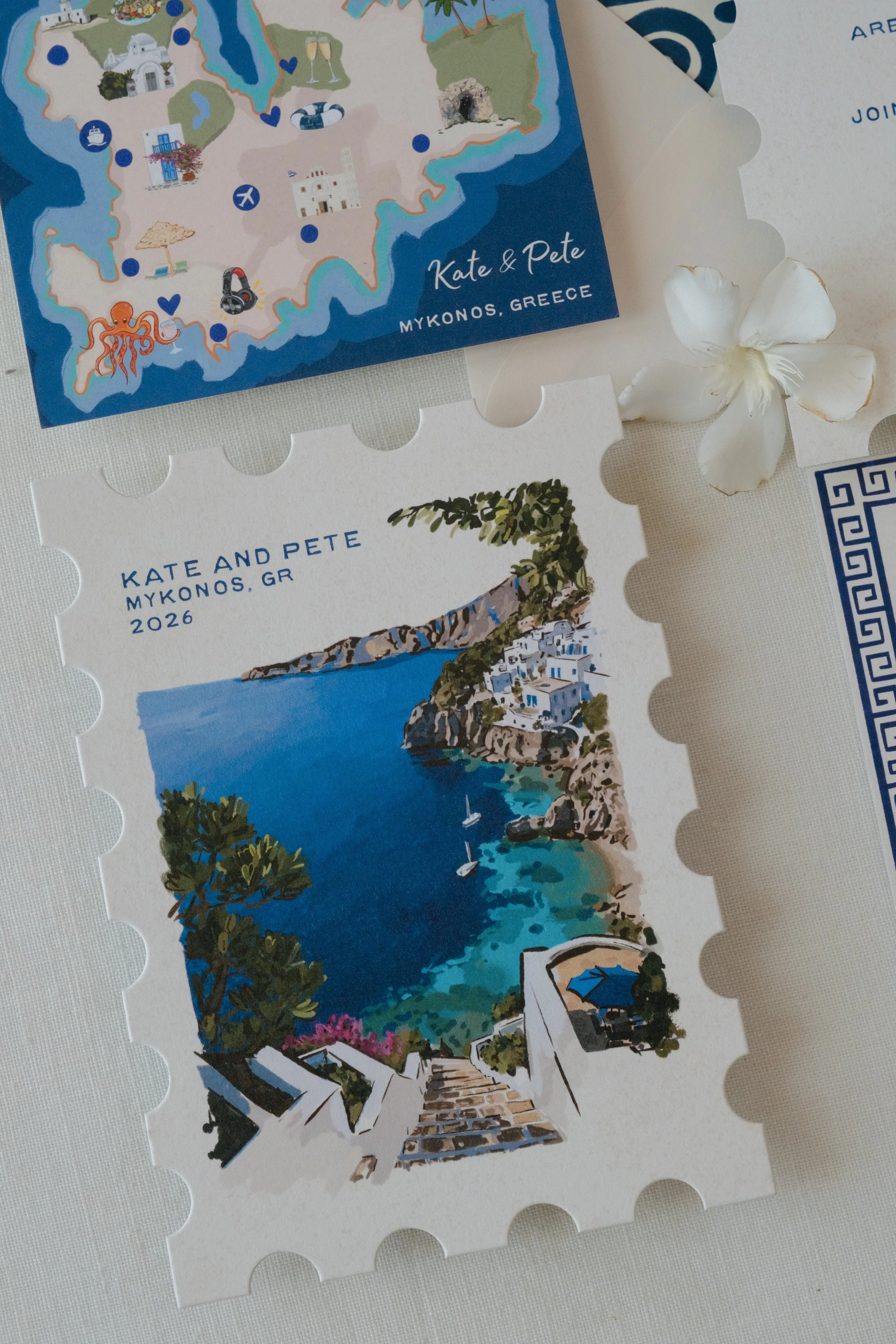 Die-cut custom stationery with illustrations of Mykonos, Greece, including a map of the island, a coastal scene, and a stamp of Mykonos, Greece