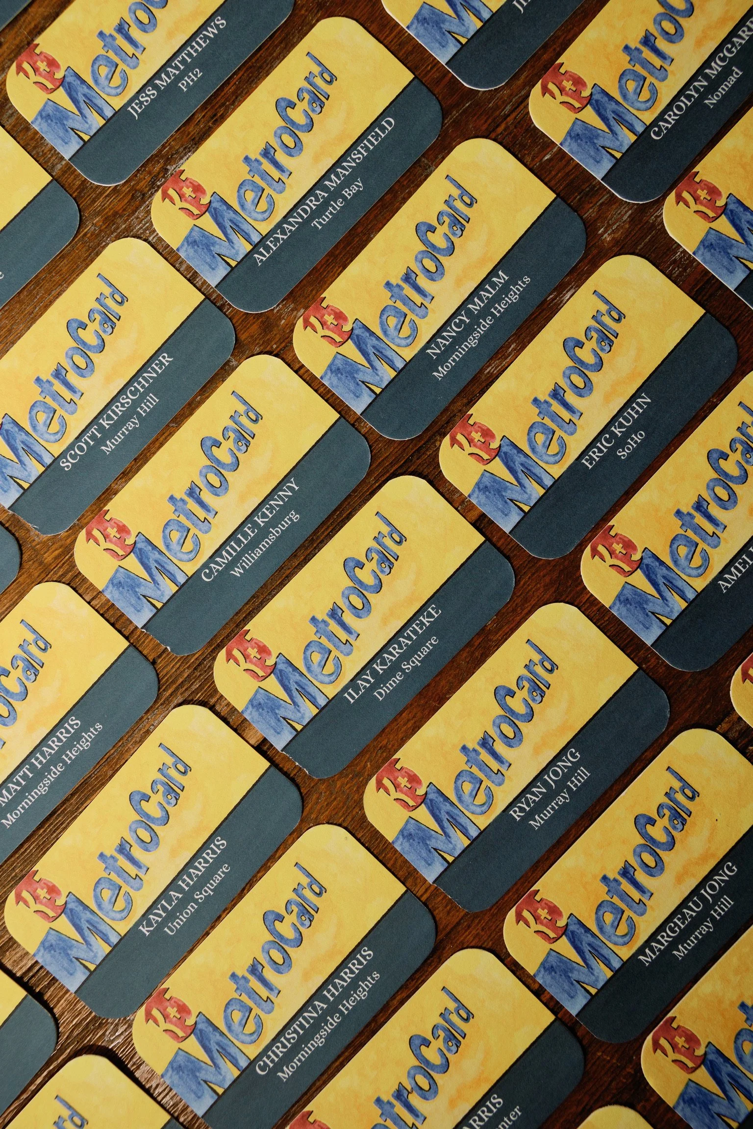 Custom illustrated place cards in classic New York City Metrocard design
