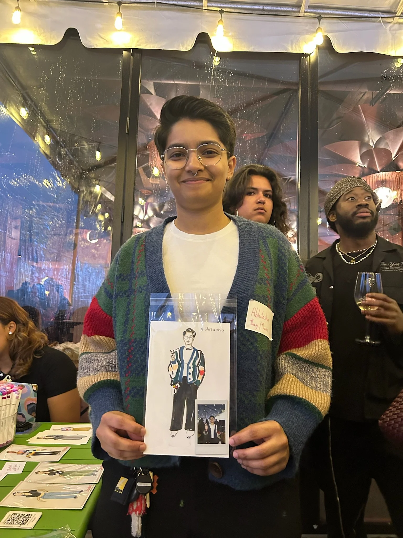 Guests with their personalized live portrait at an Adobe event in New York City