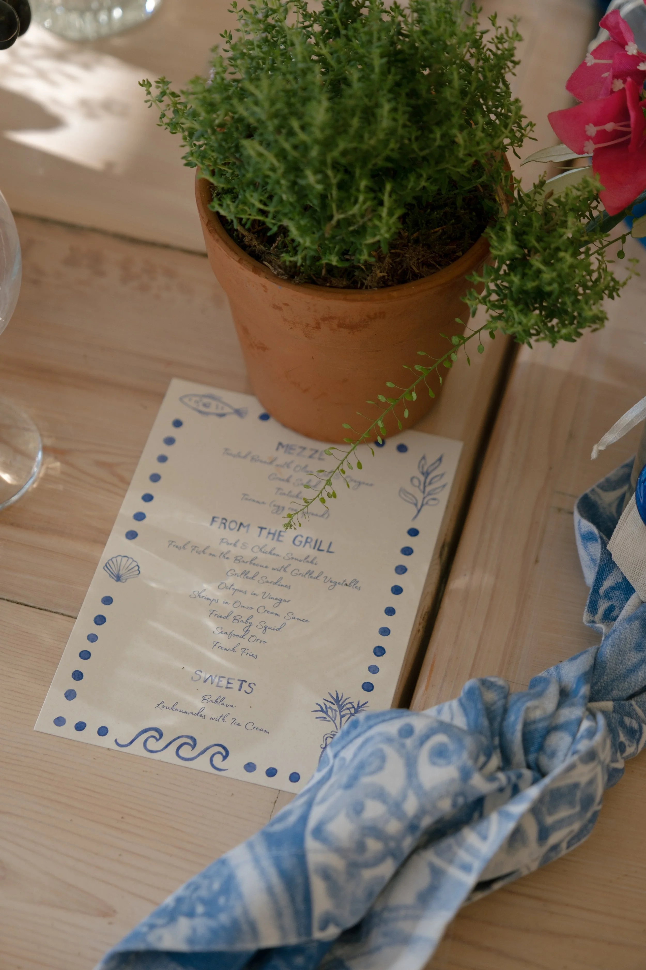Custom Greek menu with blue decorative border design hand painted details