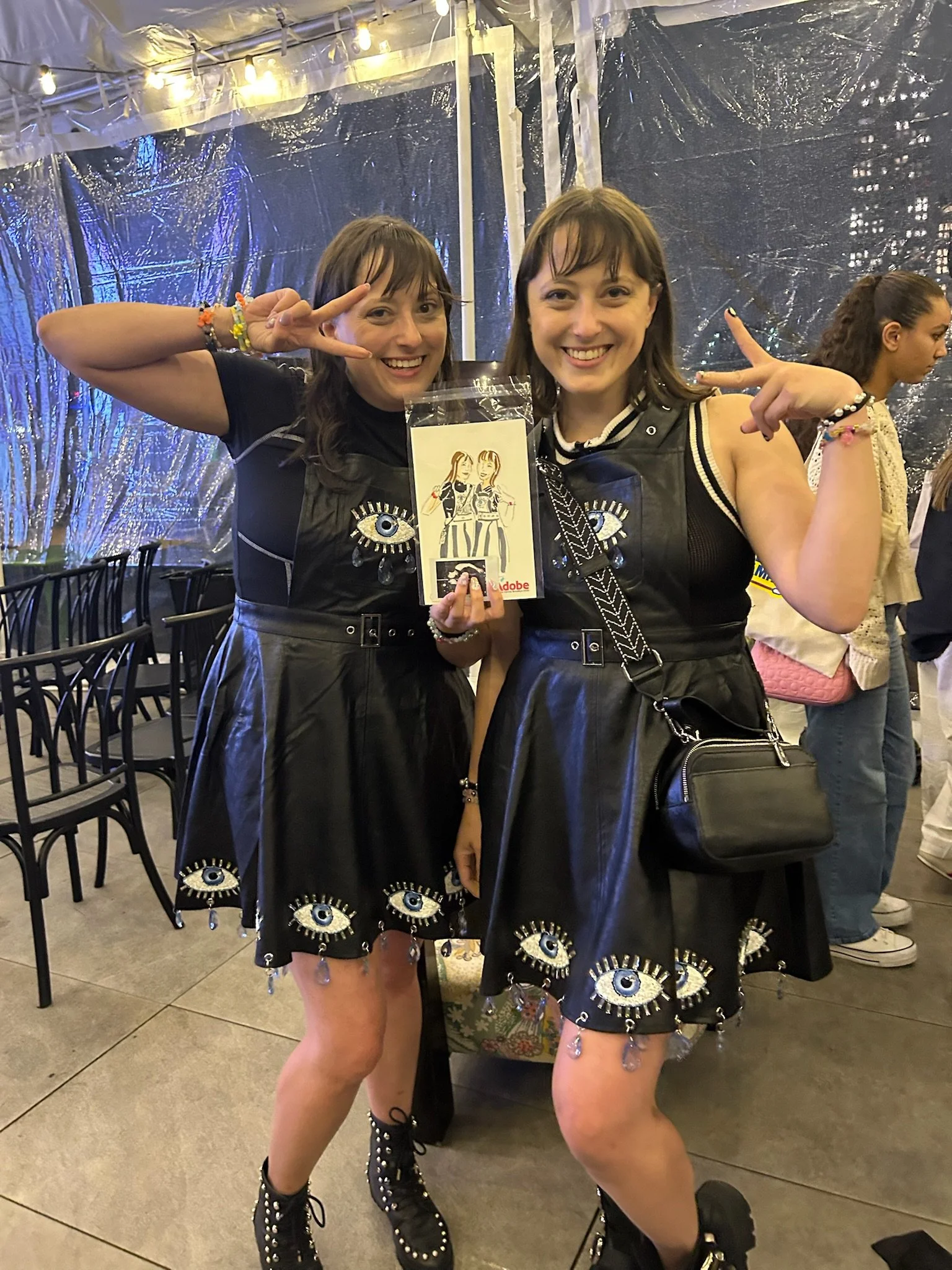 Twin Content Creators Holding Up Bespoke Portraits
