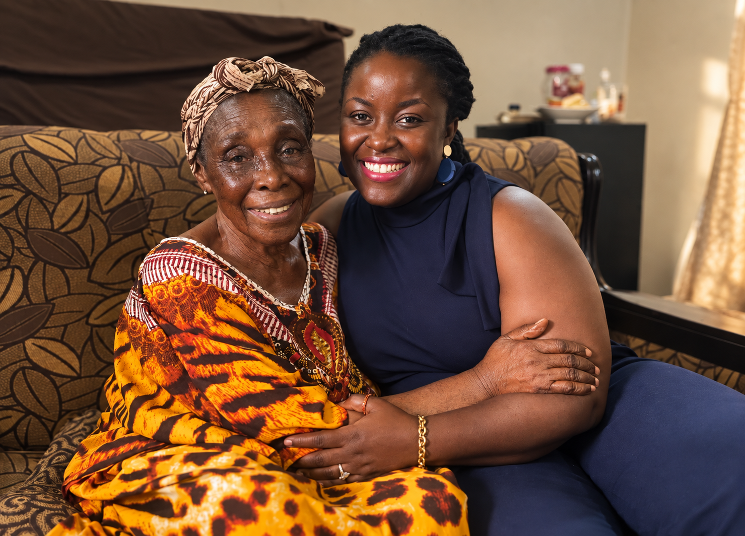 Alice seated beside her grandmother and namesake, Alice Birago Dapaah, in Ghana.