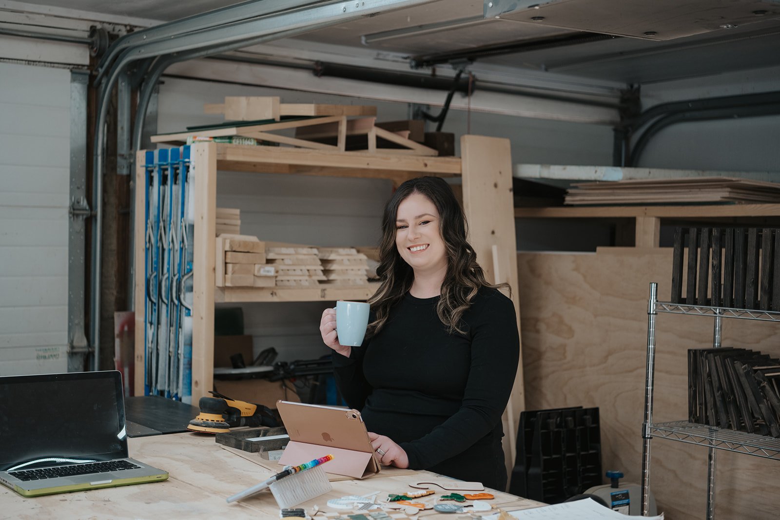 alysha smiling with a cup in hand