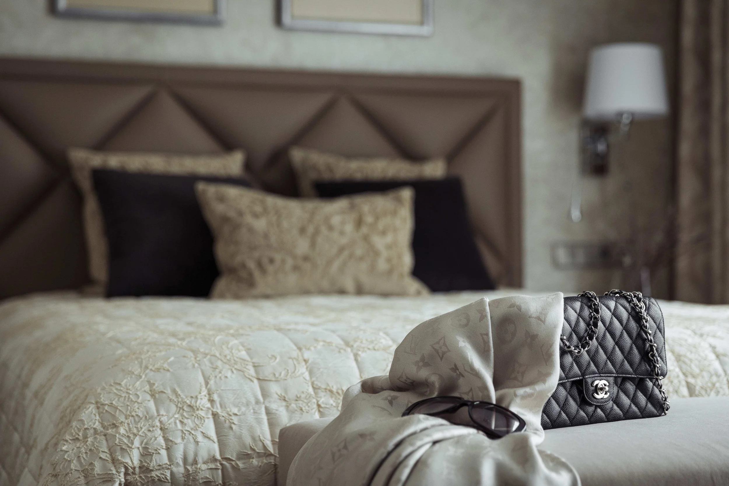 Wimbledon bedroom designed by Mond Design Interiors, featuring Art Deco-inspired style with beige and black bedding.